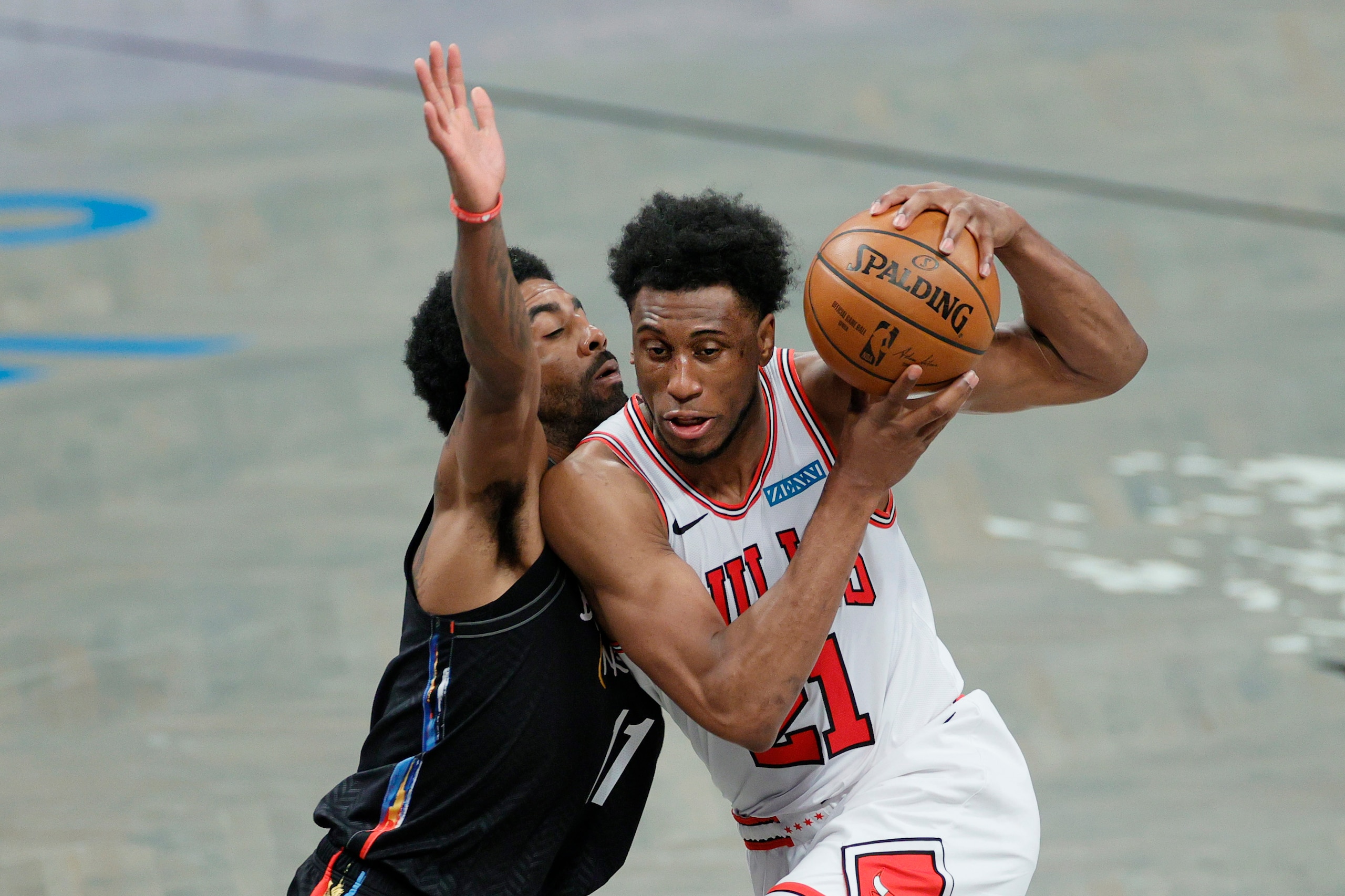 NEW YORK, NEW YORK - MAY 15: Thaddeus Young #21 of the Chicago Bulls dribbles as Kyrie Irving #11 of the Brooklyn Nets defends during the first half at Barclays Center on May 15, 2021 in the Brooklyn borough of New York City. NOTE TO USER: User expressly acknowledges and agrees that, by downloading and or using this photograph, User is consenting to the terms and conditions of the Getty Images License Agreement. (Photo by Sarah Stier/Getty Images)