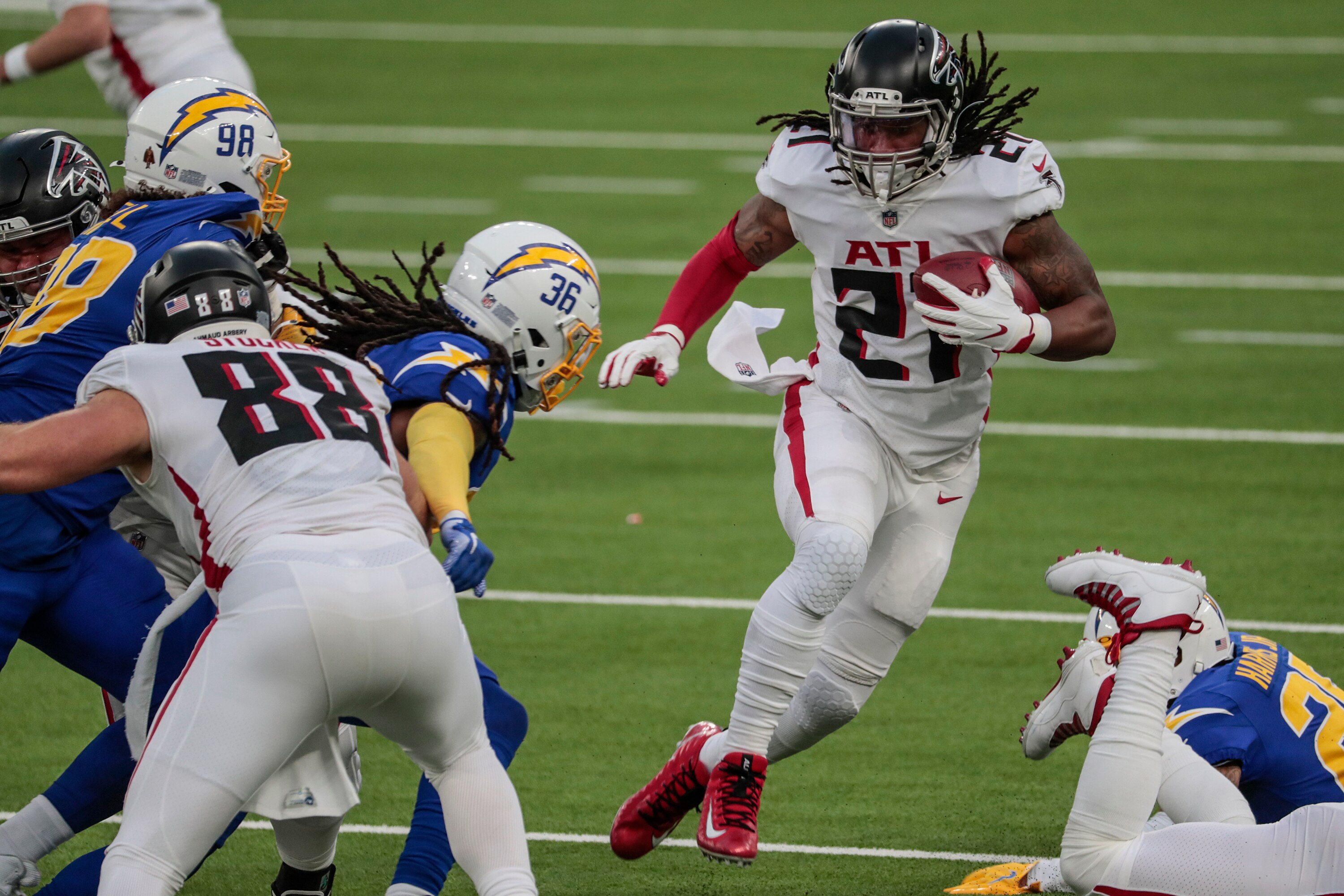 Inglewood, CA, Sunday, Dec. 13, 2020 Atlanta Falcons running back Todd Gurley (21) looks for an opening as DUPLICATE***Los Angeles Chargers safety Roderic Teamer (36)***Los Angeles Chargers strong safety Jahleel Addae (36) closes in for a tackle at SoFi Stadium.  (Robert Gauthier/ Los Angeles Times via Getty Images)
