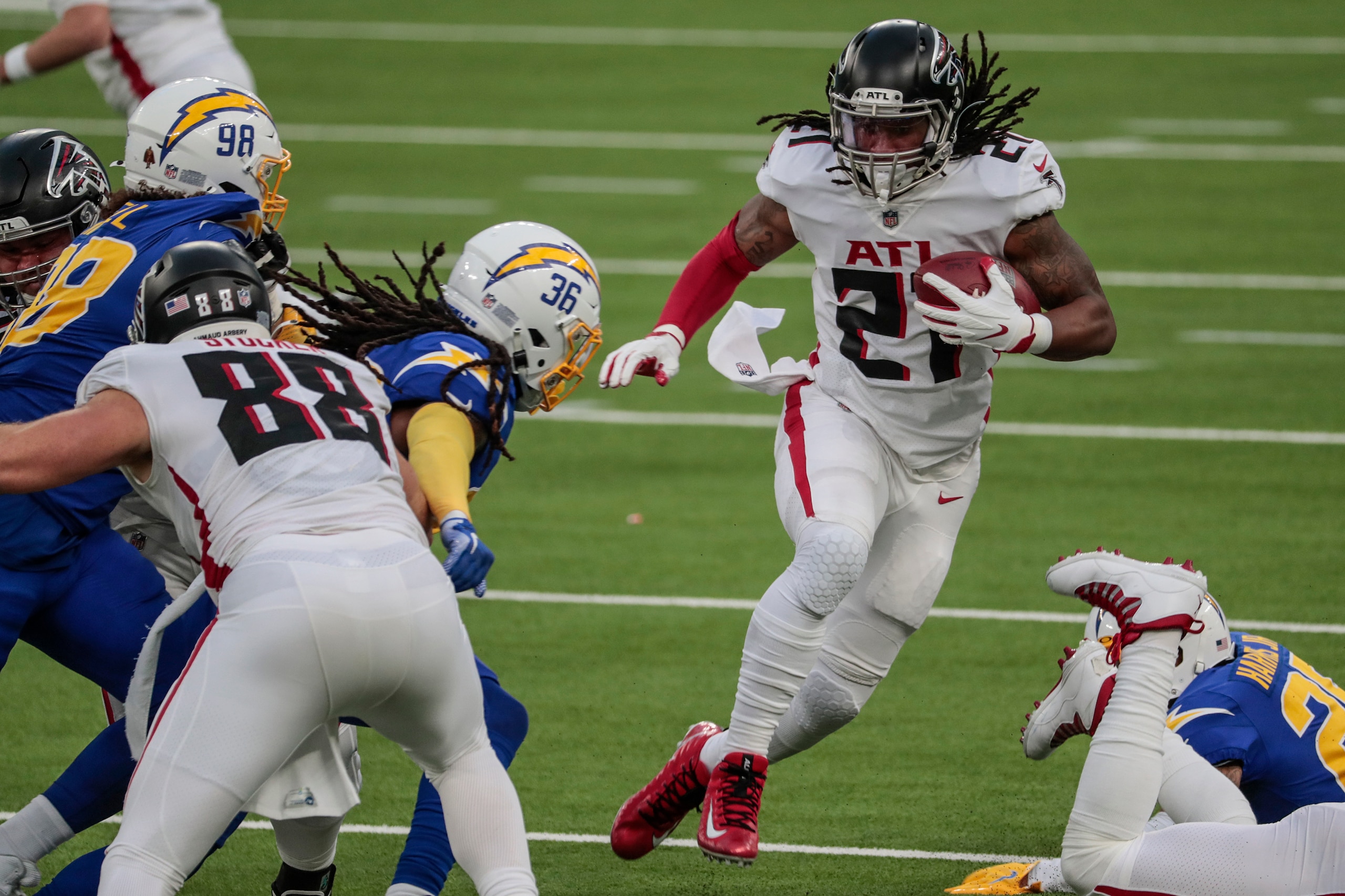 Inglewood, CA, Sunday, Dec. 13, 2020 Atlanta Falcons running back Todd Gurley (21) looks for an opening as DUPLICATE***Los Angeles Chargers safety Roderic Teamer (36)***Los Angeles Chargers strong safety Jahleel Addae (36) closes in for a tackle at SoFi Stadium.  (Robert Gauthier/ Los Angeles Times via Getty Images)