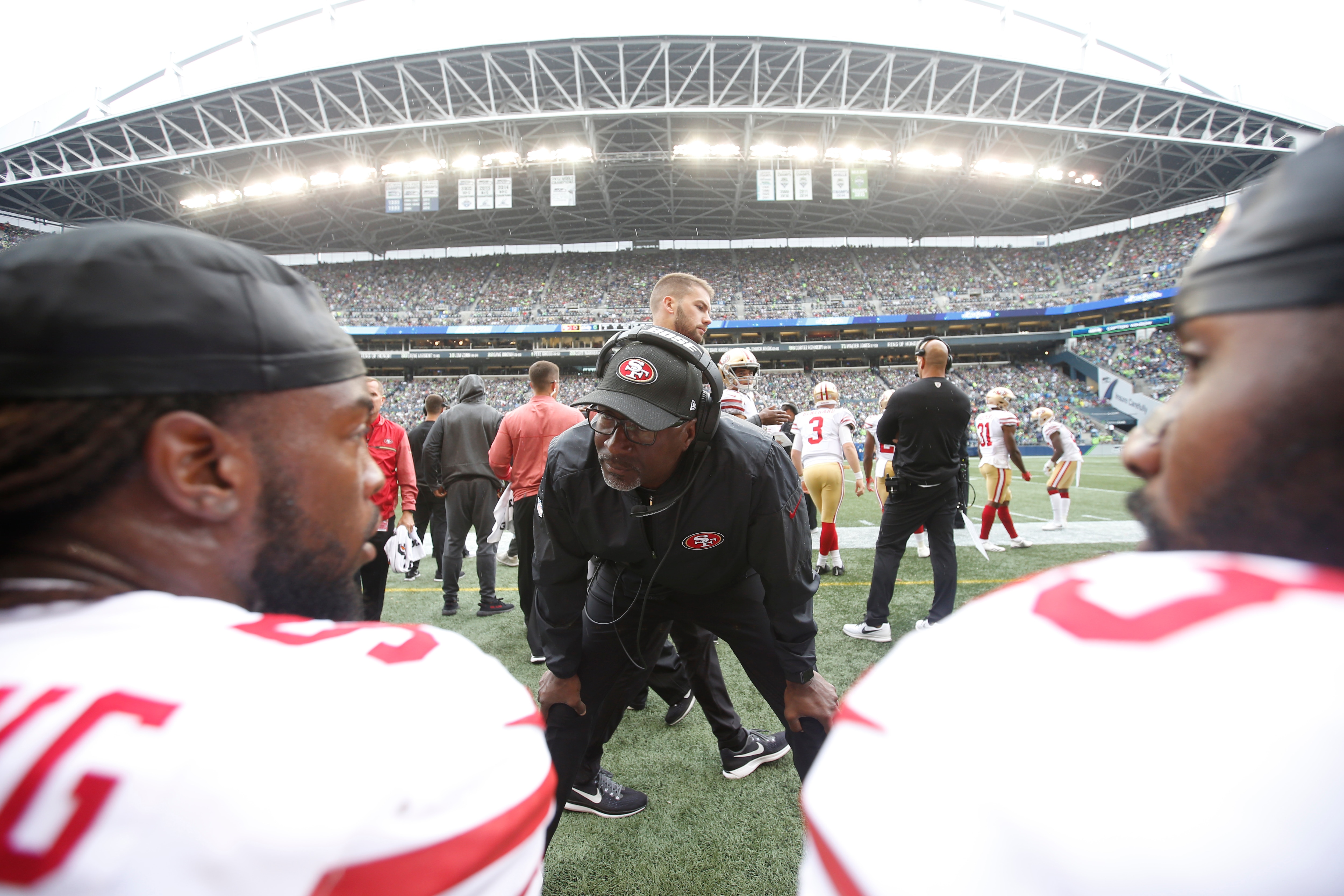SEATTLE, CA - SEPTEMBER 17: Linebackers Coach Johnny Holland of the San Francisco 49ers talks with Ray-Ray Armstrong #54 and NaVorro Bowman #53 on the sideline during the game against the Seattle Seahawks at CenturyLink Field on September 17, 2017 in Seattle, Washington. The Seahawks defeated the 49ers 12-9. (Photo by Michael Zagaris/San Francisco 49ers/Getty Images) 