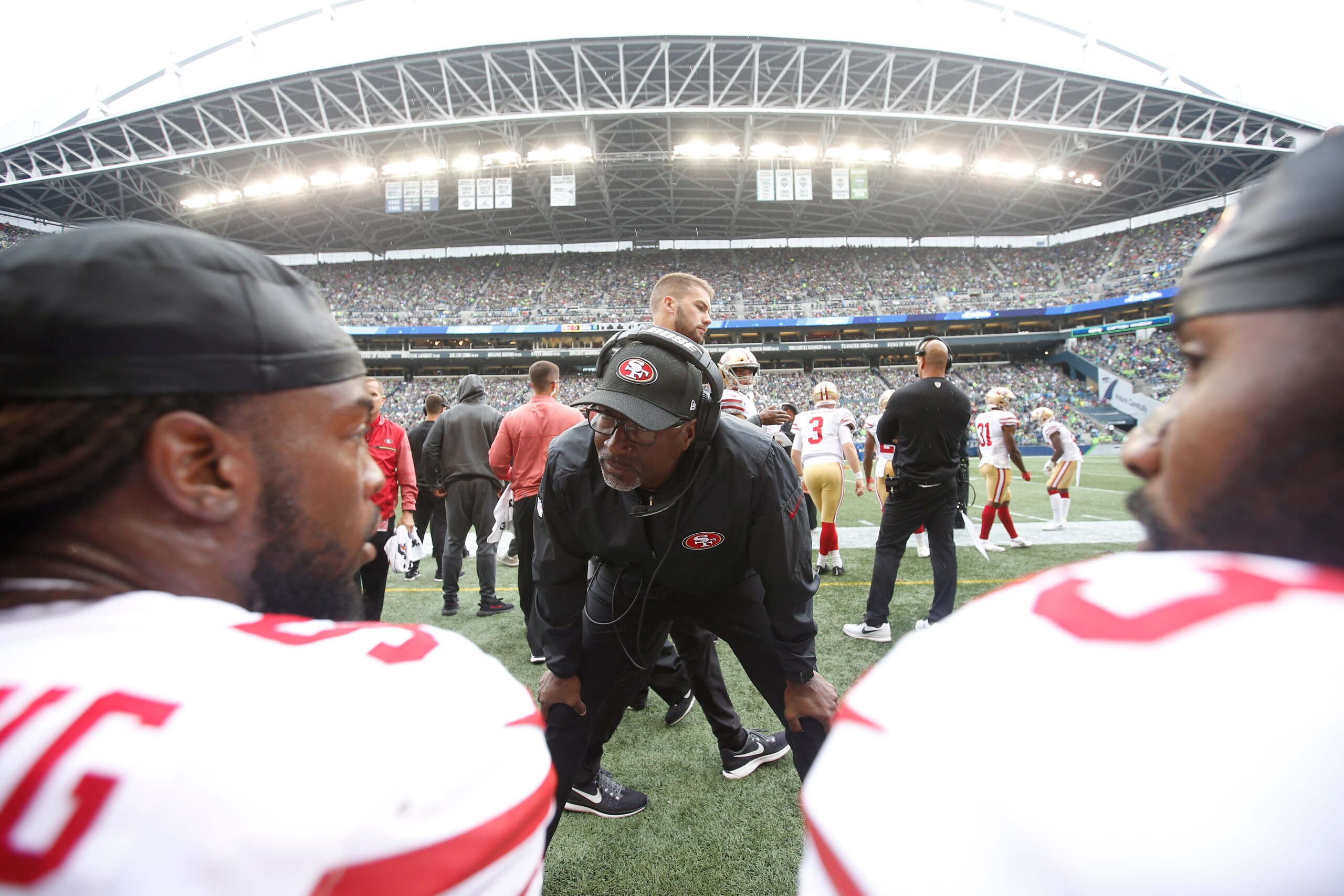 SEATTLE, CA - SEPTEMBER 17: Linebackers Coach Johnny Holland of the San Francisco 49ers talks with Ray-Ray Armstrong #54 and NaVorro Bowman #53 on the sideline during the game against the Seattle Seahawks at CenturyLink Field on September 17, 2017 in Seattle, Washington. The Seahawks defeated the 49ers 12-9. (Photo by Michael Zagaris/San Francisco 49ers/Getty Images) 