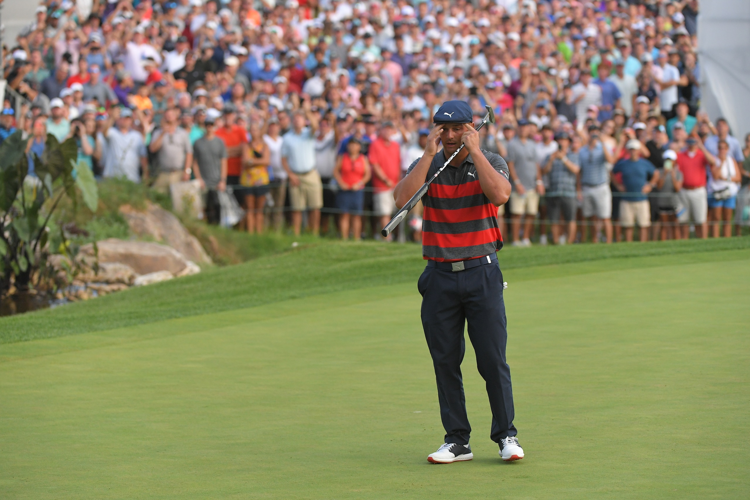 OWINGS MILLS, MD - AUGUST 29: Bryson DeChambeau reacts to a missed putt on the 18th green during the first playoff hole during the final round of the BMW Championship at Caves Valley Golf Club on August 29, 2021 in Owings Mills, Maryland. (Photo by Ben Jared/PGA TOUR via Getty Images)