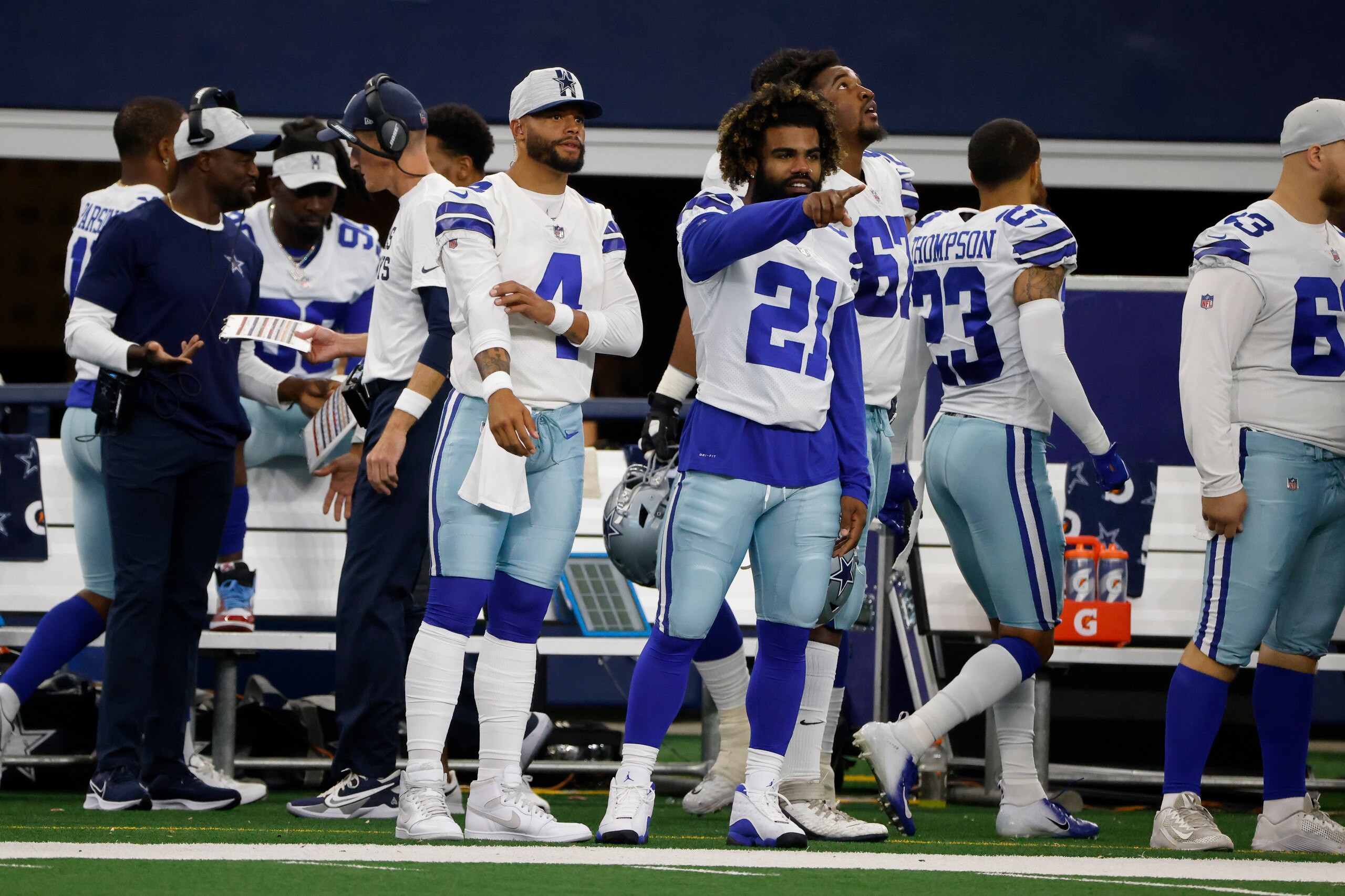 Dallas Cowboys quarterback Dak Prescott (4) and running back Ezekiel Elliott (21) watch play in the first half of a preseason NFL football game against the Jacksonville Jaguars in Arlington, Texas, Sunday, Aug. 29, 2021. (AP Photo/Michael Ainsworth) Dallas Cowboys quarterback Dak Prescott (4) and running back Ezekiel Elliott (21) watch play in the first half of a preseason NFL football game against the Jacksonville Jaguars in Arlington, Texas, Sunday, Aug. 29, 2021. (AP Photo/Michael Ainsworth)