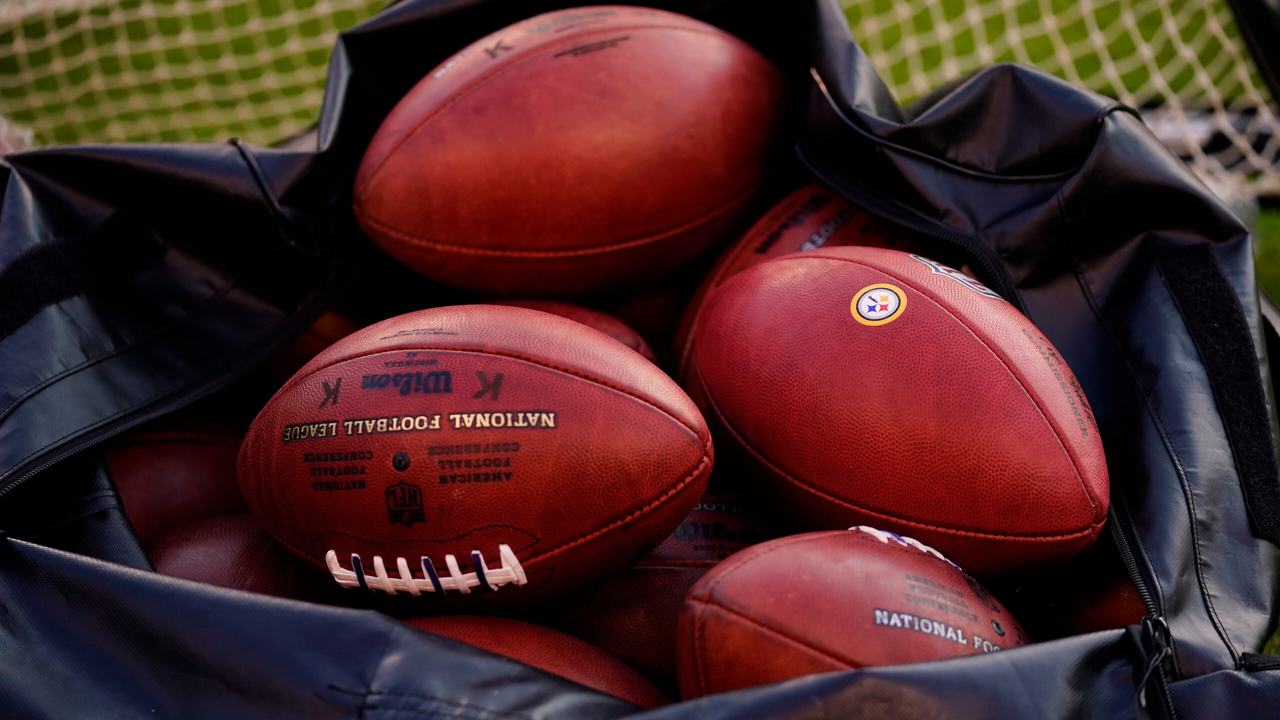 Shown is a bag of footballs before a preseason NFL football game between the Philadelphia Eagles and the Pittsburgh Steelers Thursday, Aug. 12, 2021, in Philadelphia. (AP Photo/Matt Slocum)