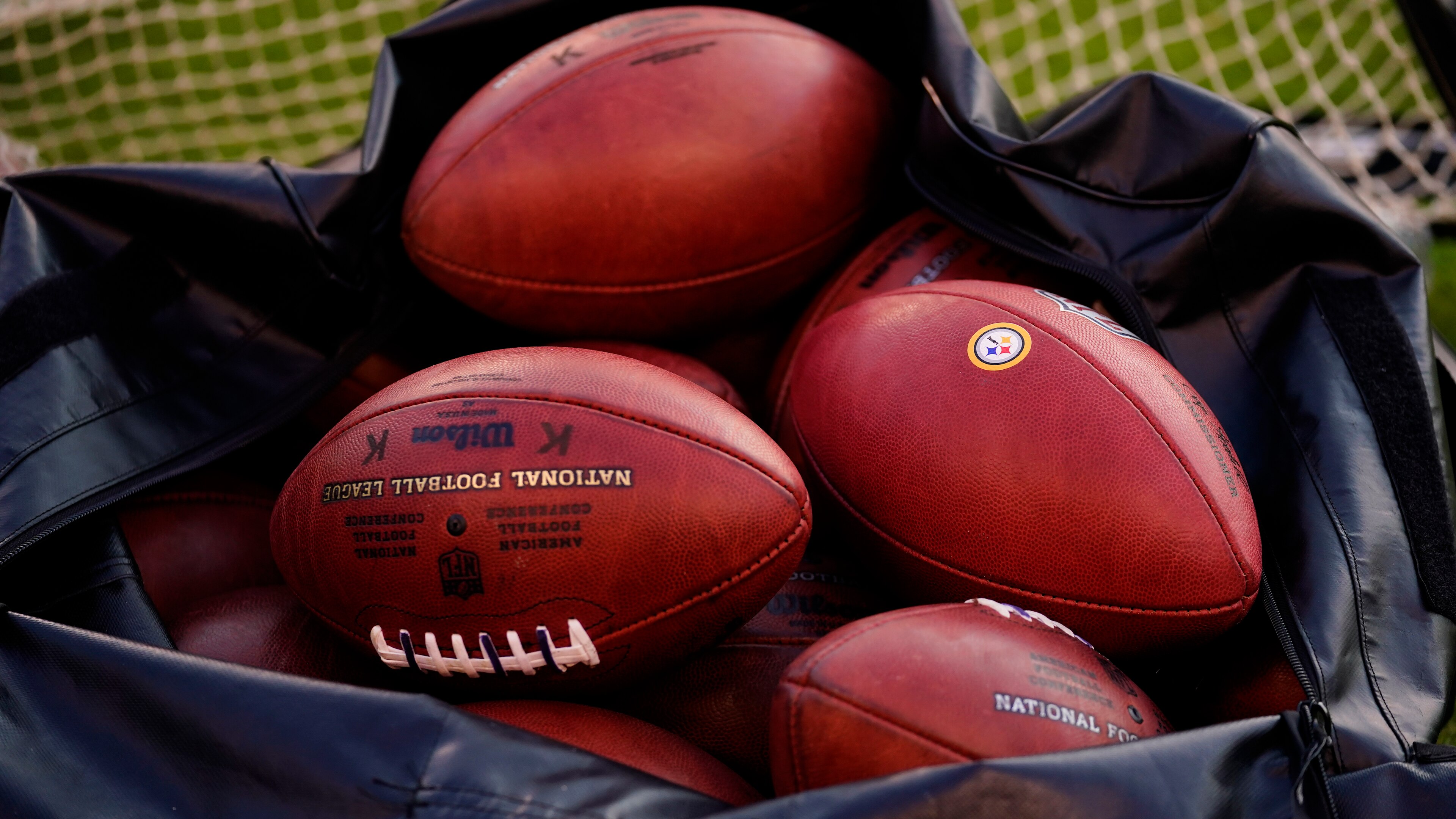 Shown is a bag of footballs before a preseason NFL football game between the Philadelphia Eagles and the Pittsburgh Steelers Thursday, Aug. 12, 2021, in Philadelphia. (AP Photo/Matt Slocum)