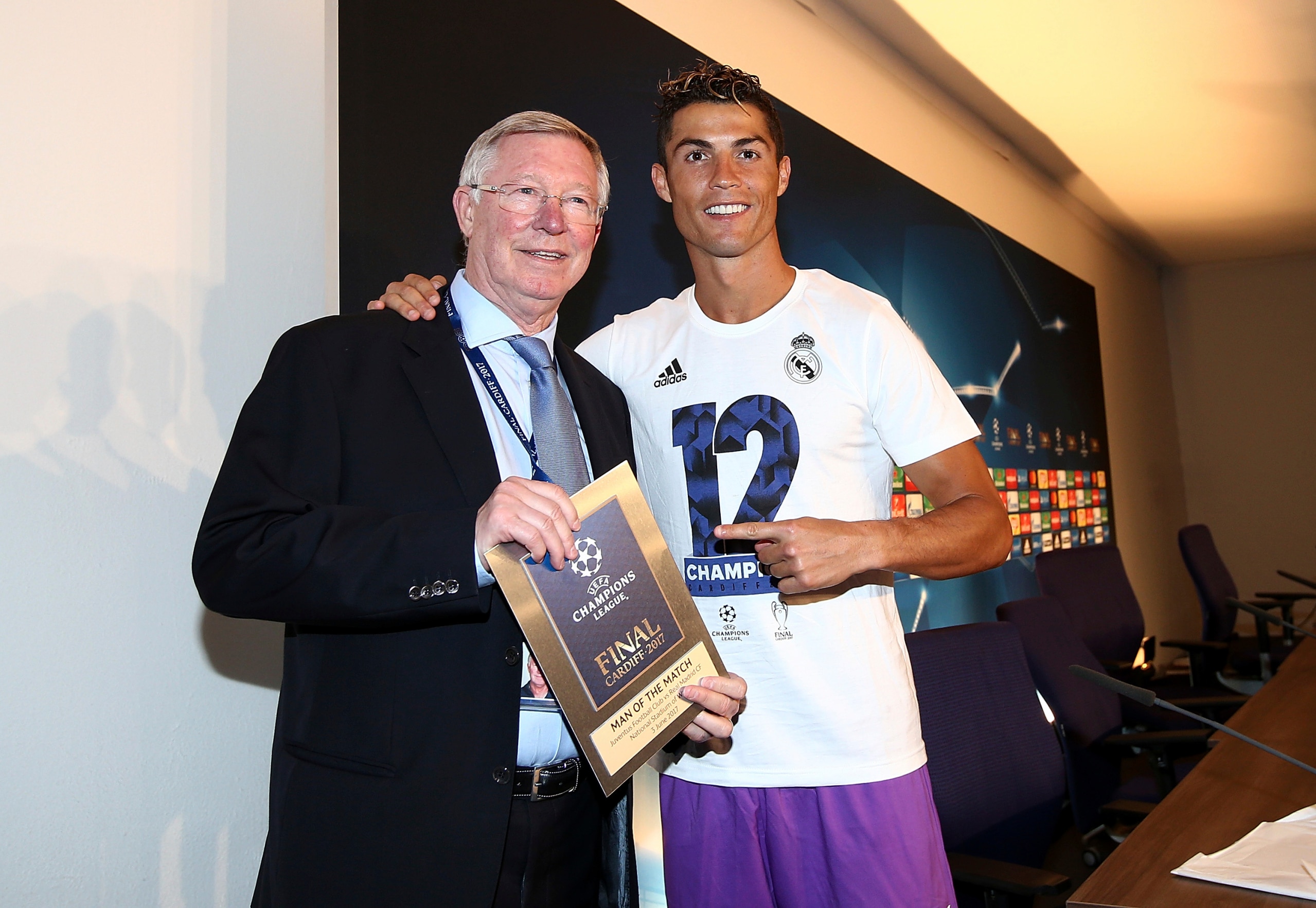 CARDIFF, WALES - JUNE 03:  In this handout image provided by UEFA, Cristiano Ronaldo of Real Madrid poses with the Man of the Match award and Sir Alex Ferguson after the UEFA Champions League Final between Juventus and Real Madrid at National Stadium of Wales on June 3, 2017 in Cardiff, Wales.  (Photo by Handout/UEFA via Getty Images)