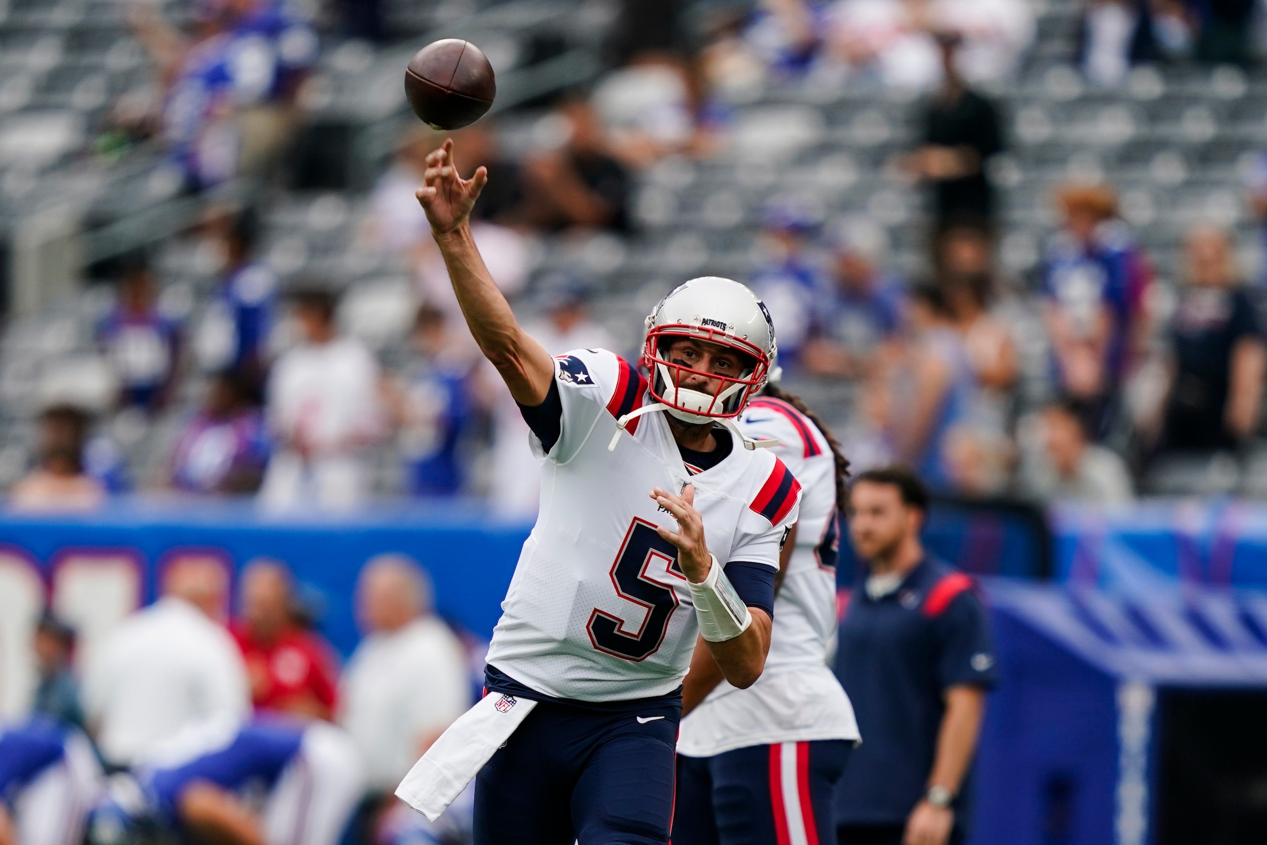 New England Patriots quarterback Brian Hoyer (5) warms up before an NFL preseason football game against the New York Giants Sunday, Aug. 29, 2021, in East Rutherford, N.J. (AP Photo/John Minchillo)