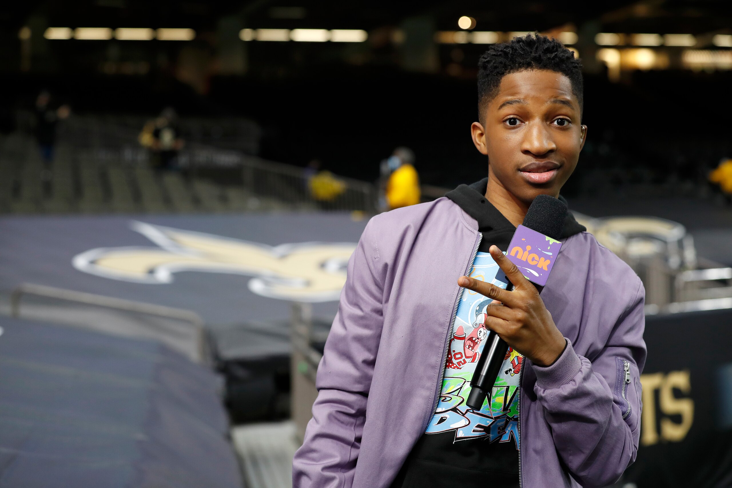 Nickelodeon reporter Lex Lumpkin during an NFL wild-card playoff football game between the New Orleans Saints and the Chicago Bears, Sunday, Jan. 10, 2021, in New Orleans. (AP Photo/Tyler Kaufman)