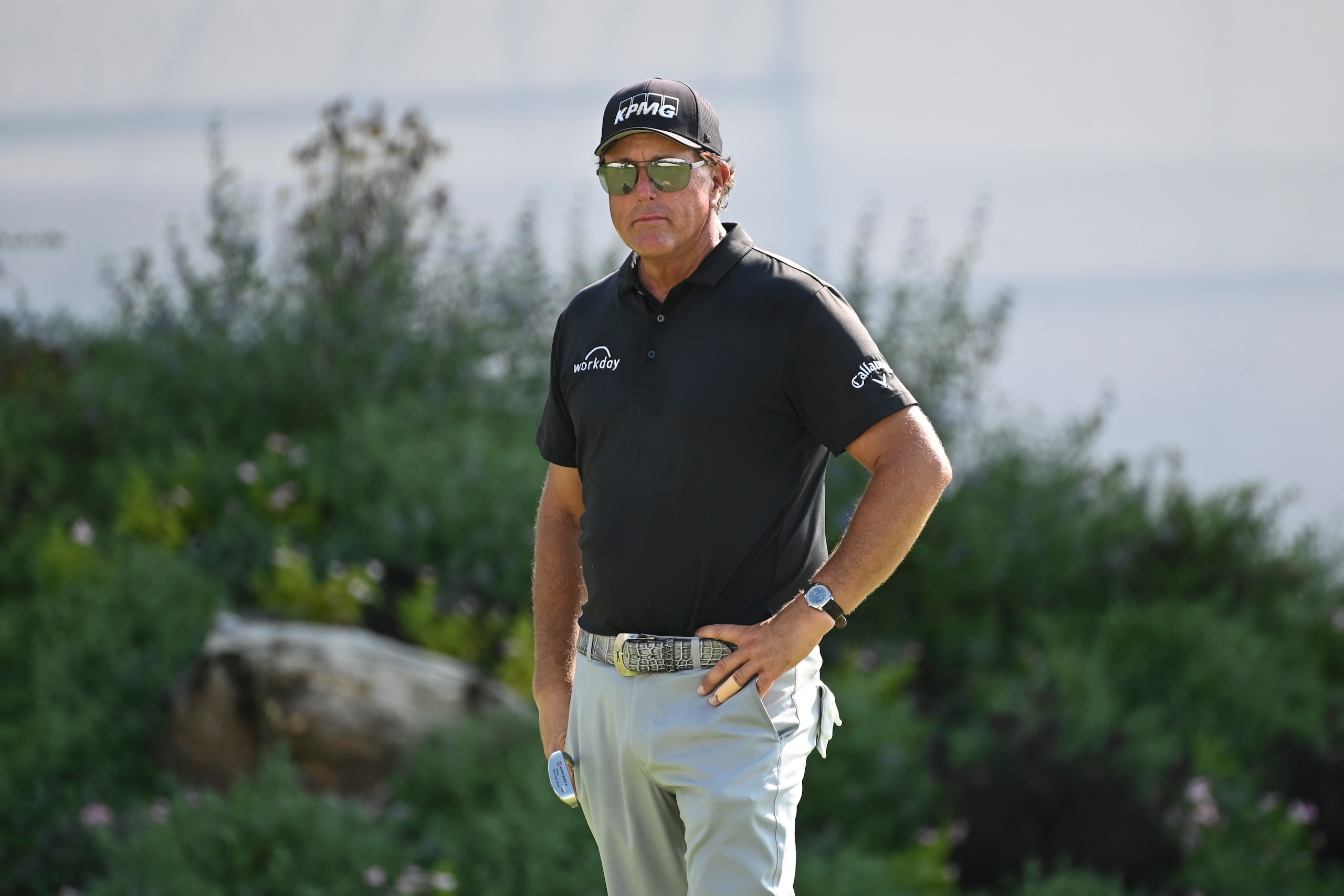 Phil Mickelson looks on before putting on the 18th green during the second round of the BMW Championship golf tournament, Saturday, Aug. 28, 2021, at Caves Valley Golf Club in Owings Mills, Md. (AP Photo/Terrance Williams)
