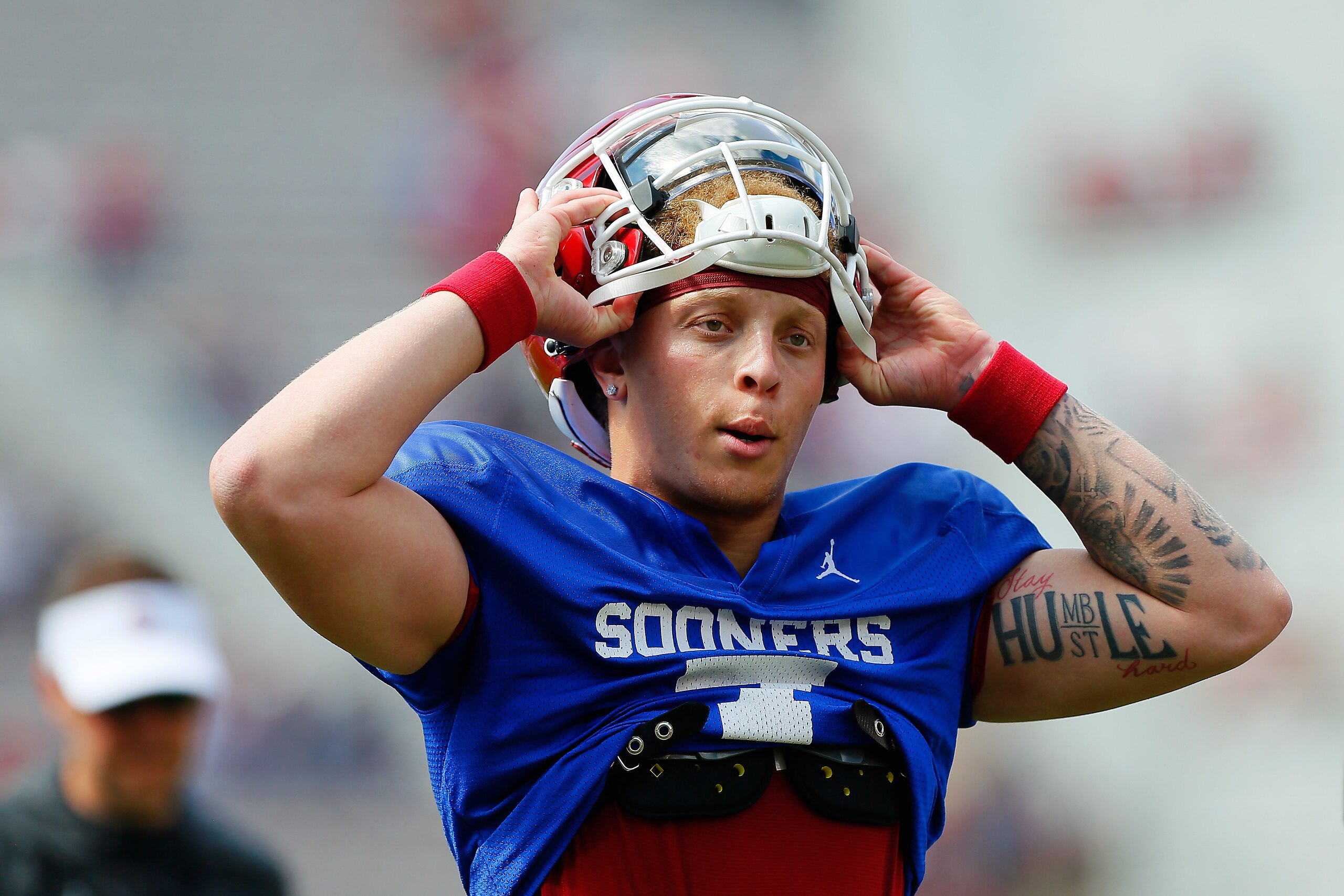 NORMAN, OK - APRIL 24:  Quarterback Spencer Rattler #7 of the Oklahoma Sooners pulls on his helmet for the team's spring game at Gaylord Family Oklahoma Memorial Stadium on April 24, 2021 in Norman, Oklahoma.   (Photo by Brian Bahr/Getty Images)