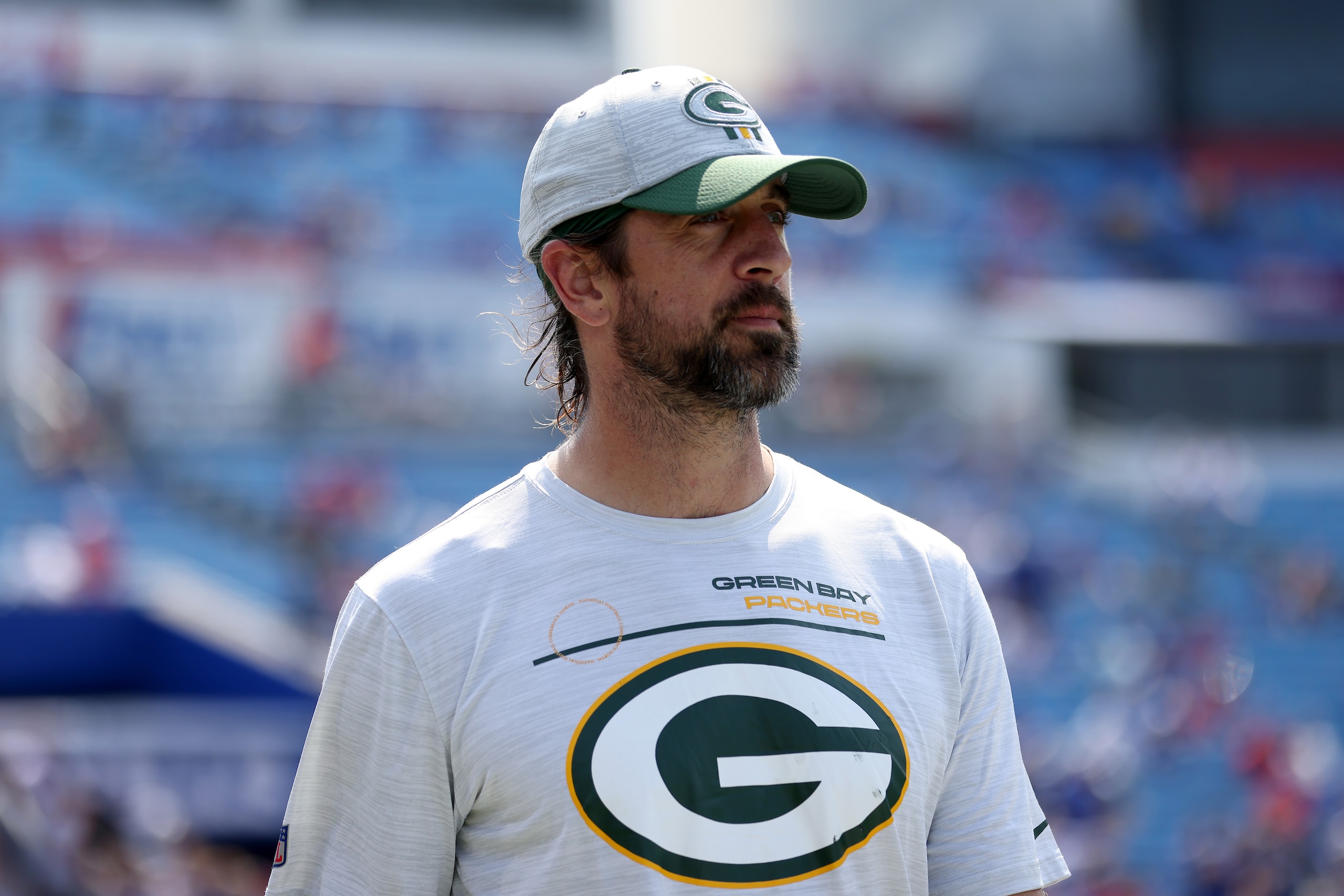 ORCHARD PARK, NEW YORK - AUGUST 28: Aaron Rodgers #12 of the Green Bay Packers walks on the field prior to a game against the Buffalo Bills at Highmark Stadium on August 28, 2021 in Orchard Park, New York. (Photo by Bryan M. Bennett/Getty Images)