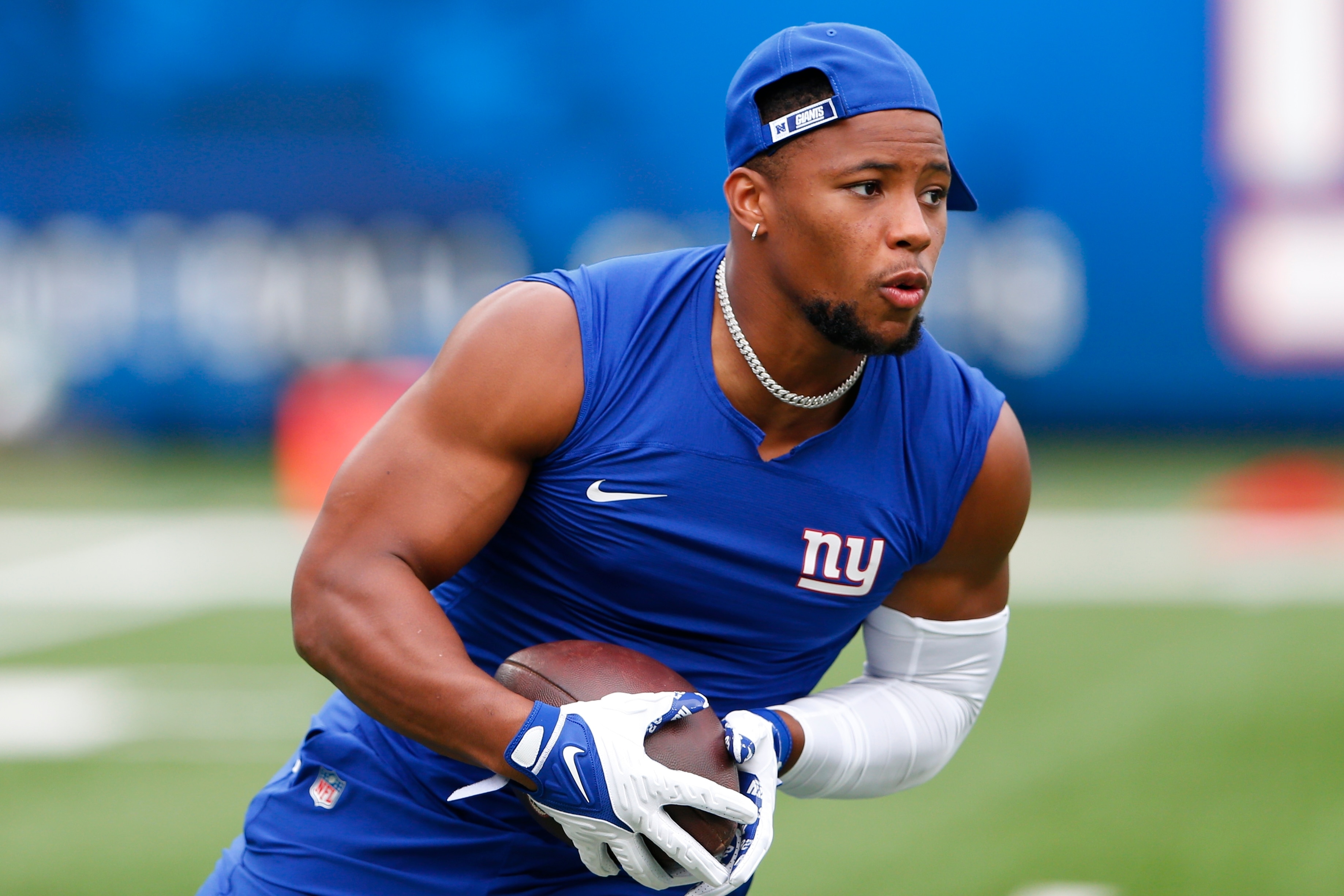 New York Giants running back Saquon Barkley warms up before an NFL preseason football game against the New England Patriots Sunday, Aug. 29, 2021, in East Rutherford, N.J. (AP Photo/Noah K. Murray)