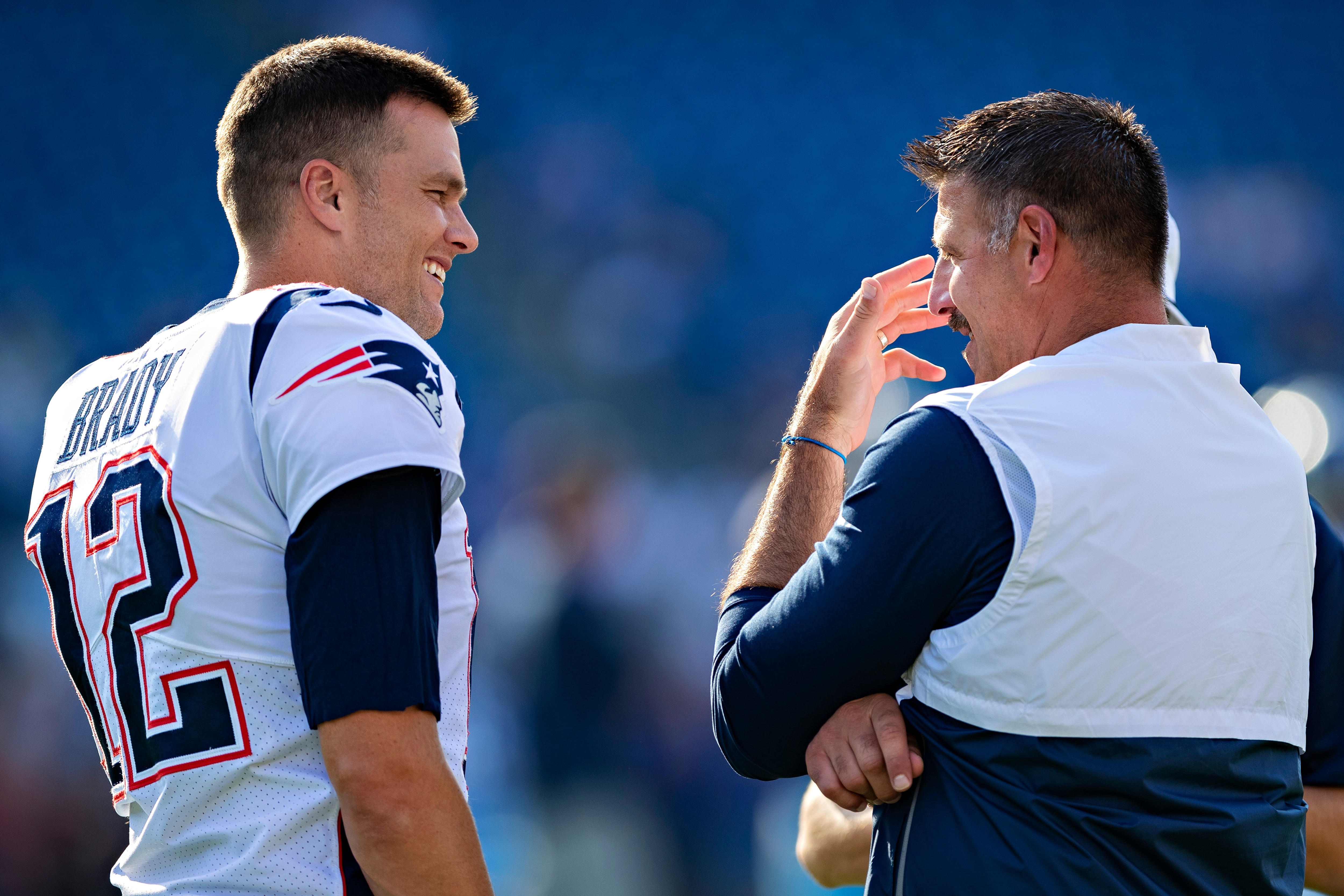 NASHVILLE, TN - AUGUST 17:  Tom Brady #12 of the New England Patriots talks with Head Coach Mike Vrabel of the Tennessee Titans before the game during week two of the preseason at Nissan Stadium on August 17, 2019 in Nashville, Tennessee.  The Patriots defeated the Titans 22-17.  (Photo by Wesley Hitt/Getty Images)