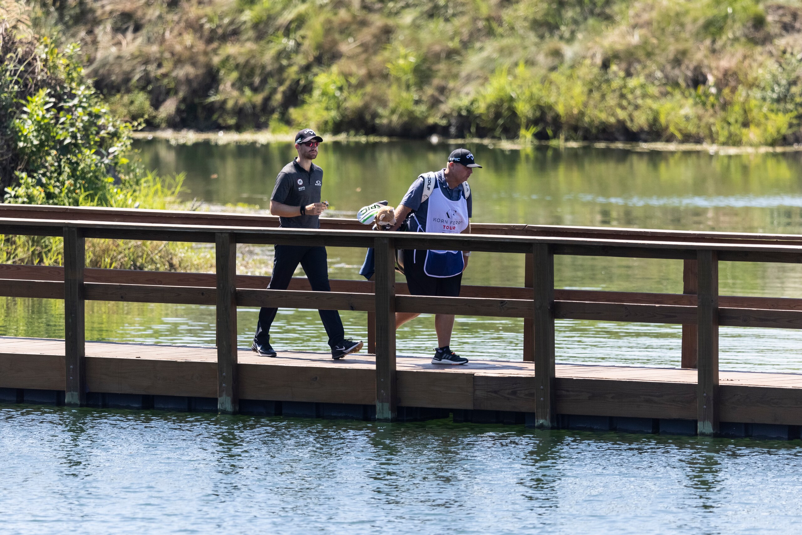 NEWBURGH, IN - SEPTEMBER 02: Patrick Rodgers and his caddie walk across a bridge to the 6th hole during the first round of the Korn Ferry Tour Championship presented by United Leasing and Financing at Victoria National Golf Club on September 2, 2021 in Newburgh, Indiana. (Photo by James Gilbert/PGA TOUR via Getty Images)