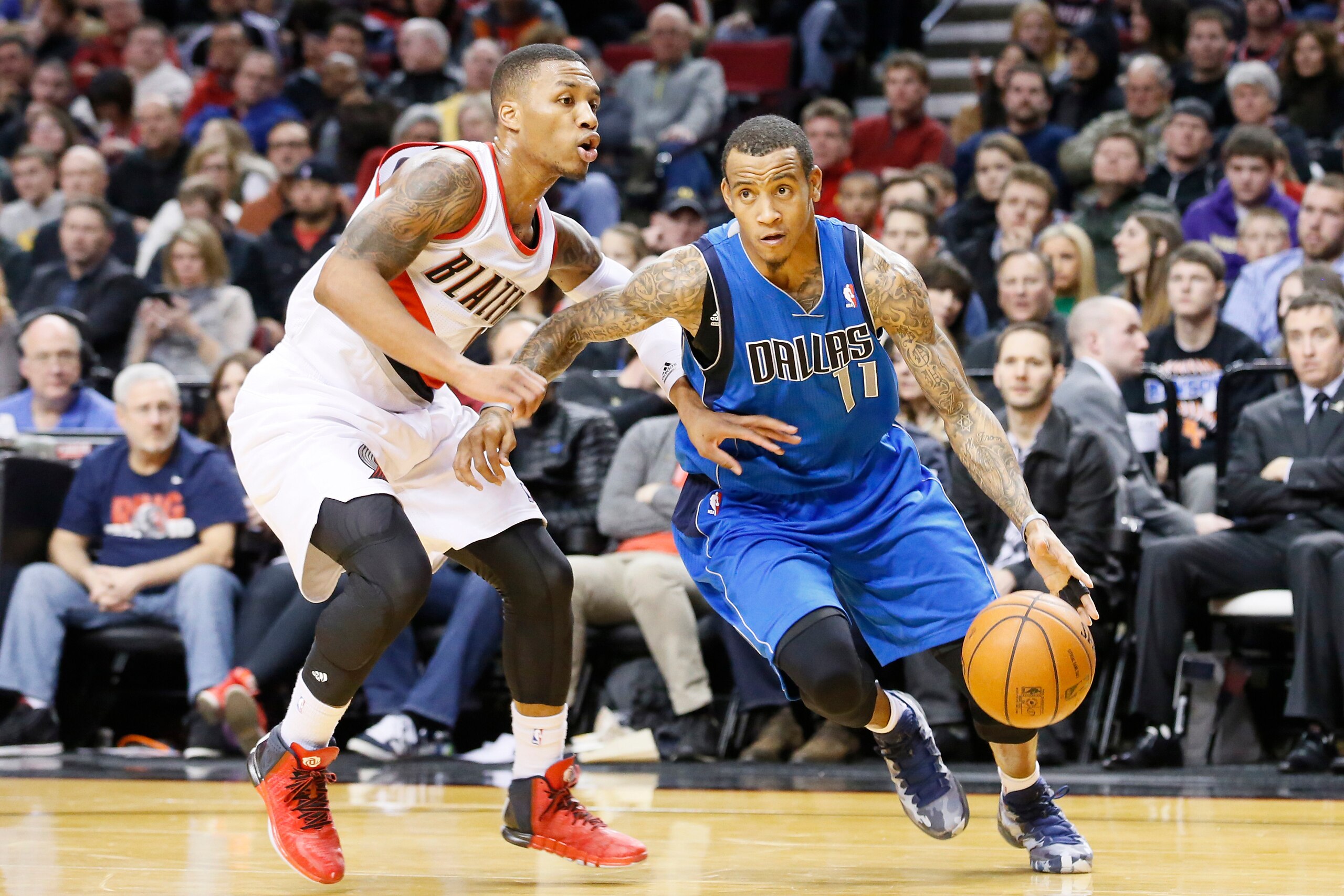 PORTLAND, OR - DECEMBER 7: Dallas Mavericks shooting guard Monta Ellis (11) drives past Portland Trail Blazers point guard Damian Lillard (0) during the Dallas Mavericks 108-106 victory over the Portland Trail Blazers at the Moda Center on December 7, 2013 in Portland, Oregon. NOTE TO USER: User expressly acknowledges and agrees that, by downloading and or using this photograph, User is consenting to the terms and conditions of the Getty Images License Agreement. (Photo by Chris Elise/Getty Images)