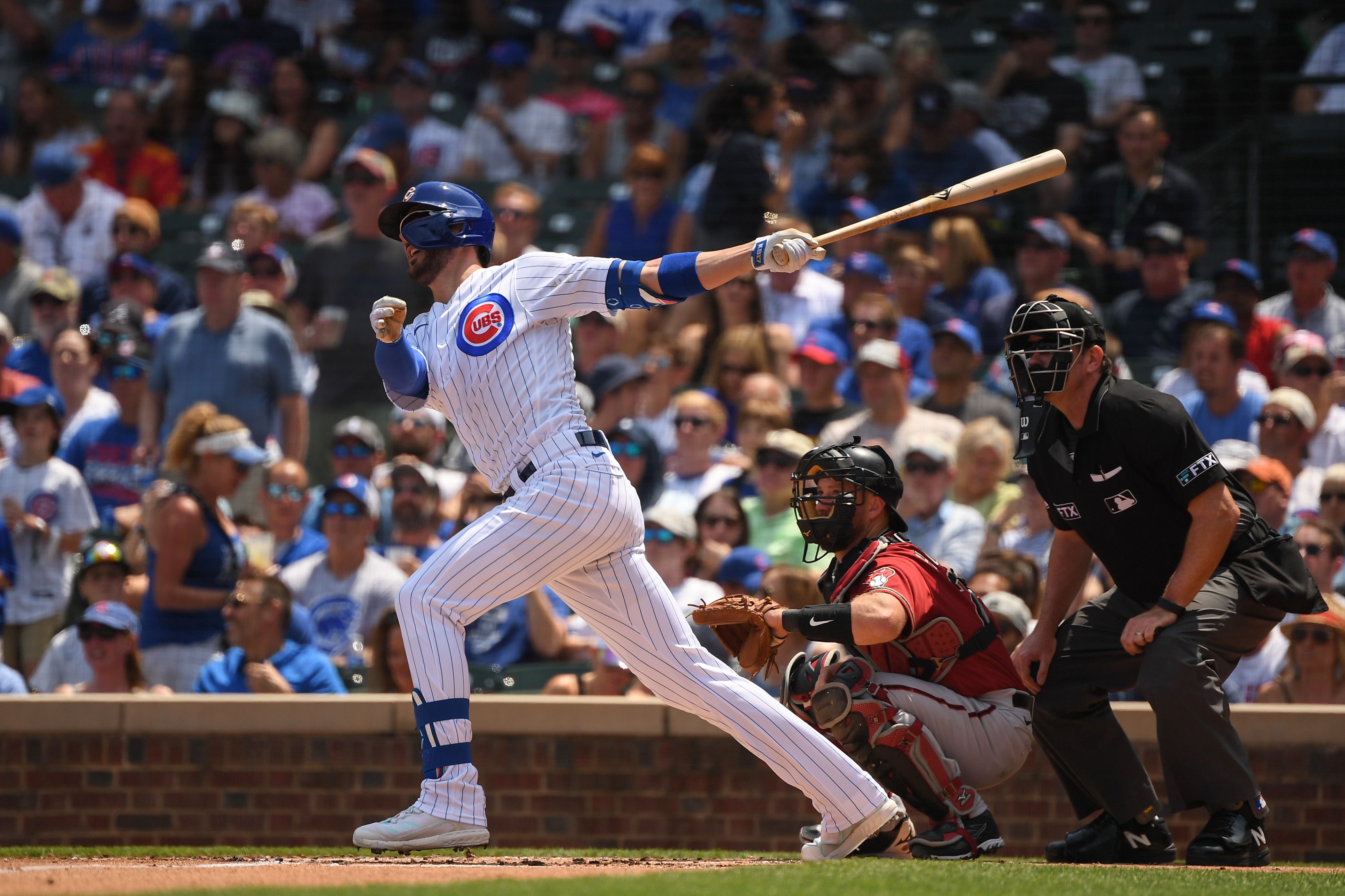 CHICAGO, ILLINOIS - JULY 25: Kris Bryant #17 of the Chicago Cubs hits a two-run home run against the Arizona Diamondbacks at Wrigley Field on July 25, 2021 in Chicago, Illinois. (Photo by Quinn Harris/Getty Images)