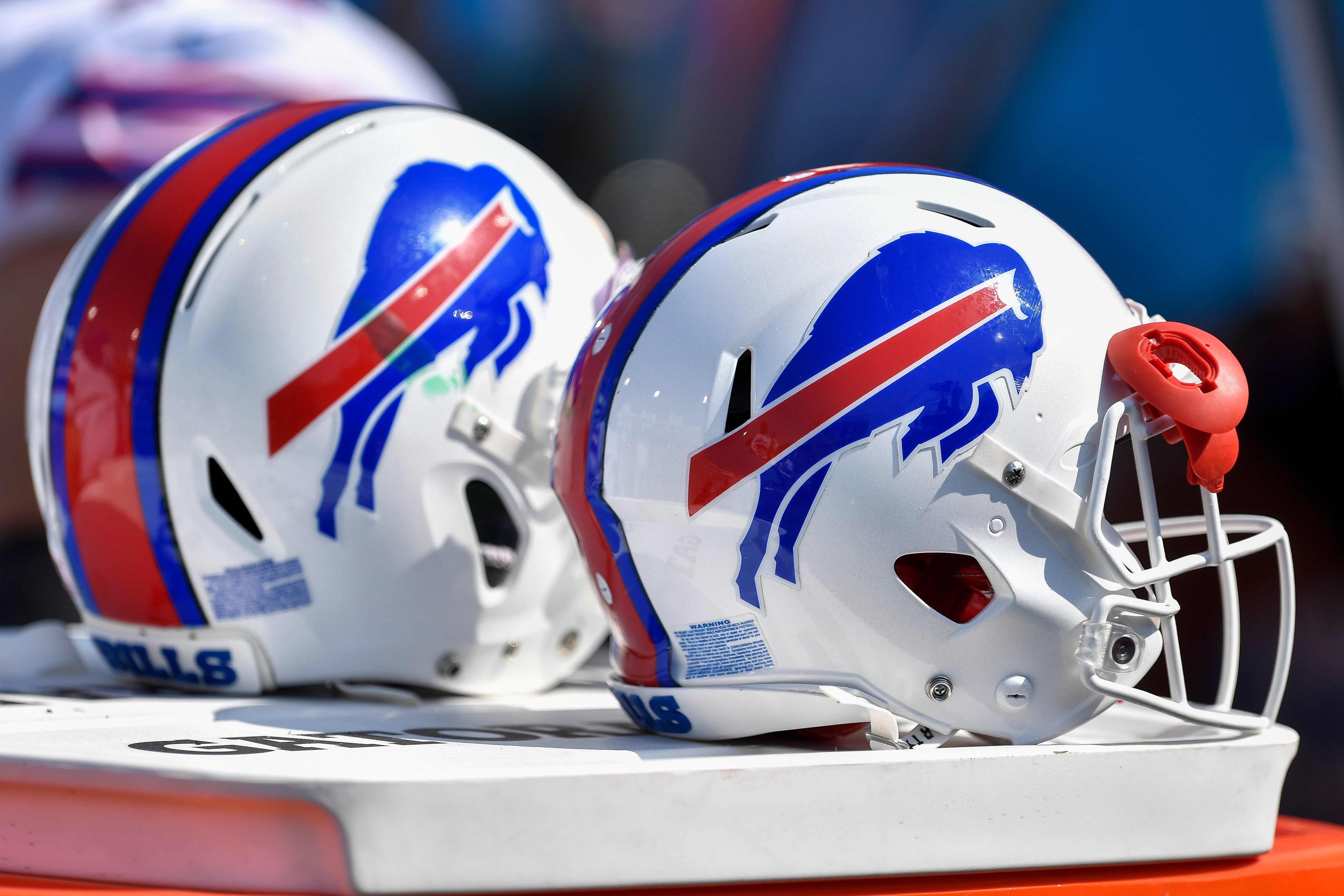Detail view of Buffalo Bills helmets on the sideline during the second half of a preseason NFL football game against the Green Bay Packers in Orchard Park, N.Y., Saturday, Aug. 28, 2021. (AP Photo/Adrian Kraus)