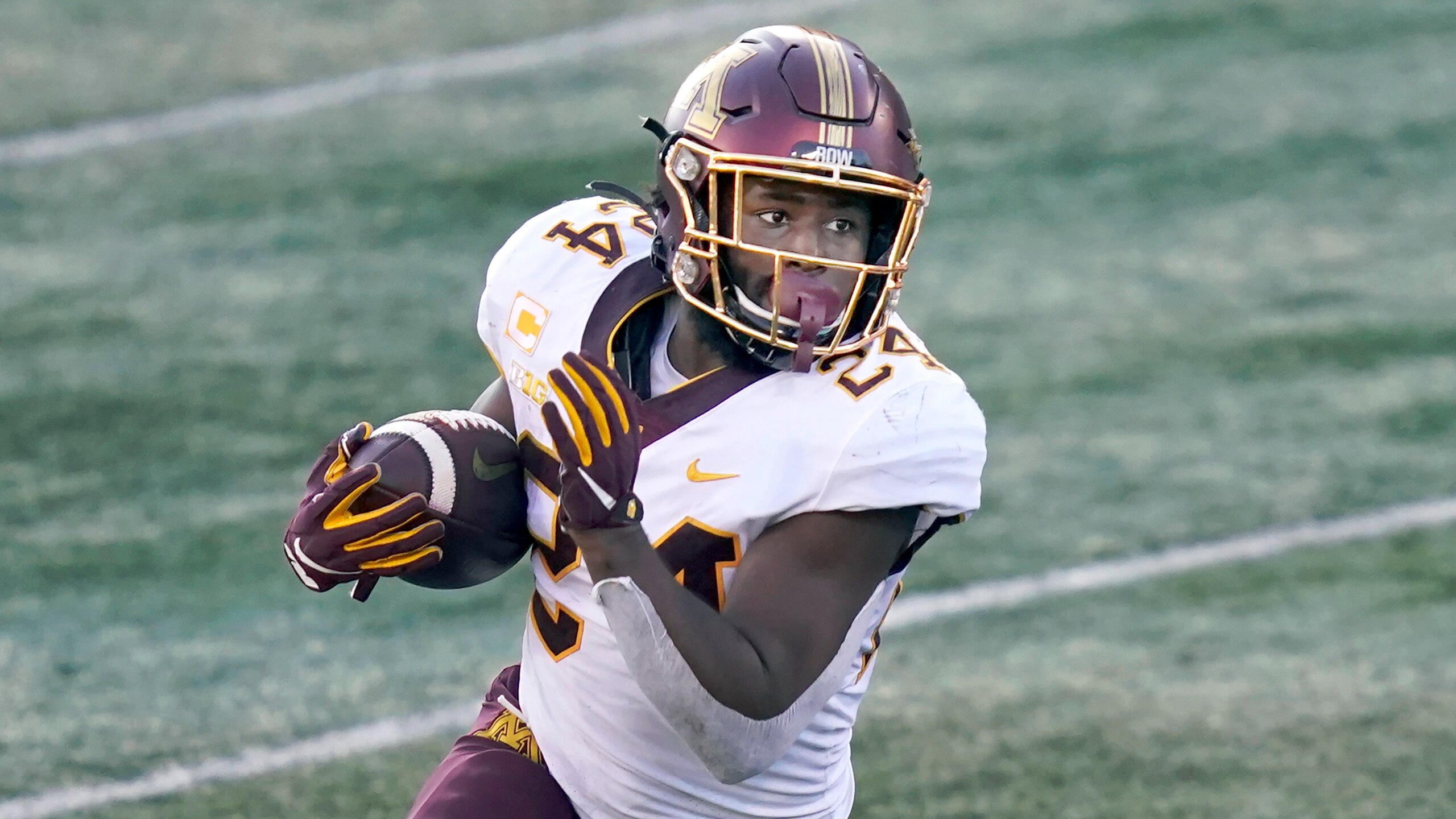 Minnesota running back Mohamed Ibrahim carries the ball during the first half of an NCAA college football game against Illinois Saturday, Nov. 7, 2020, in Champaign , Ill. (AP Photo/Charles Rex Arbogast)