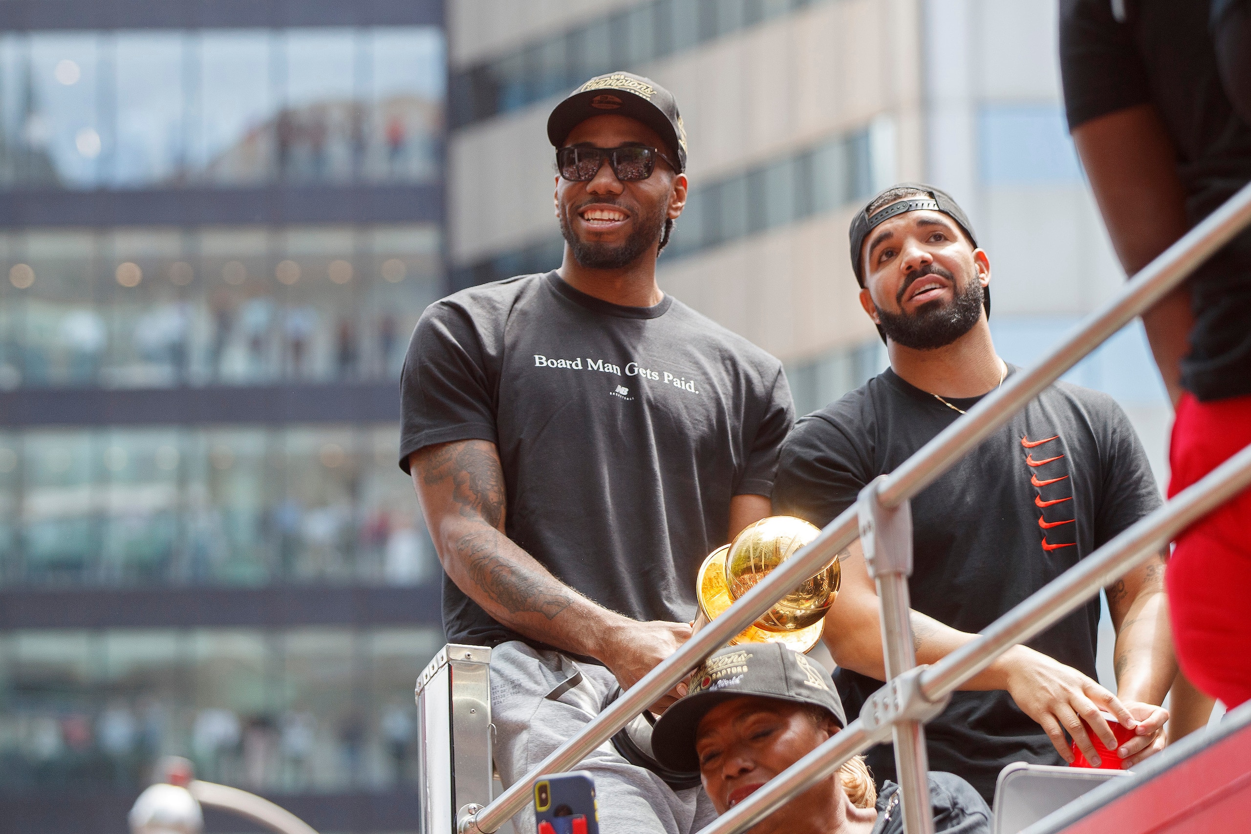 TORONTO, ON - JUNE 17:  Kawhi Leonard #2 of the Toronto Raptors and Rapper Drake are seen on the team bus during the Toronto Raptors Championship Victory Parade on June 17, 2019 in Toronto, Ontario. NOTE TO USER: User expressly acknowledges and agrees that, by downloading and/or using this photograph, user is consenting to the terms and conditions of Getty Images License Agreement. Mandatory Copyright Notice: Copyright 2019 NBAE (Photo by Mark Blinch/NBAE via Getty Images)