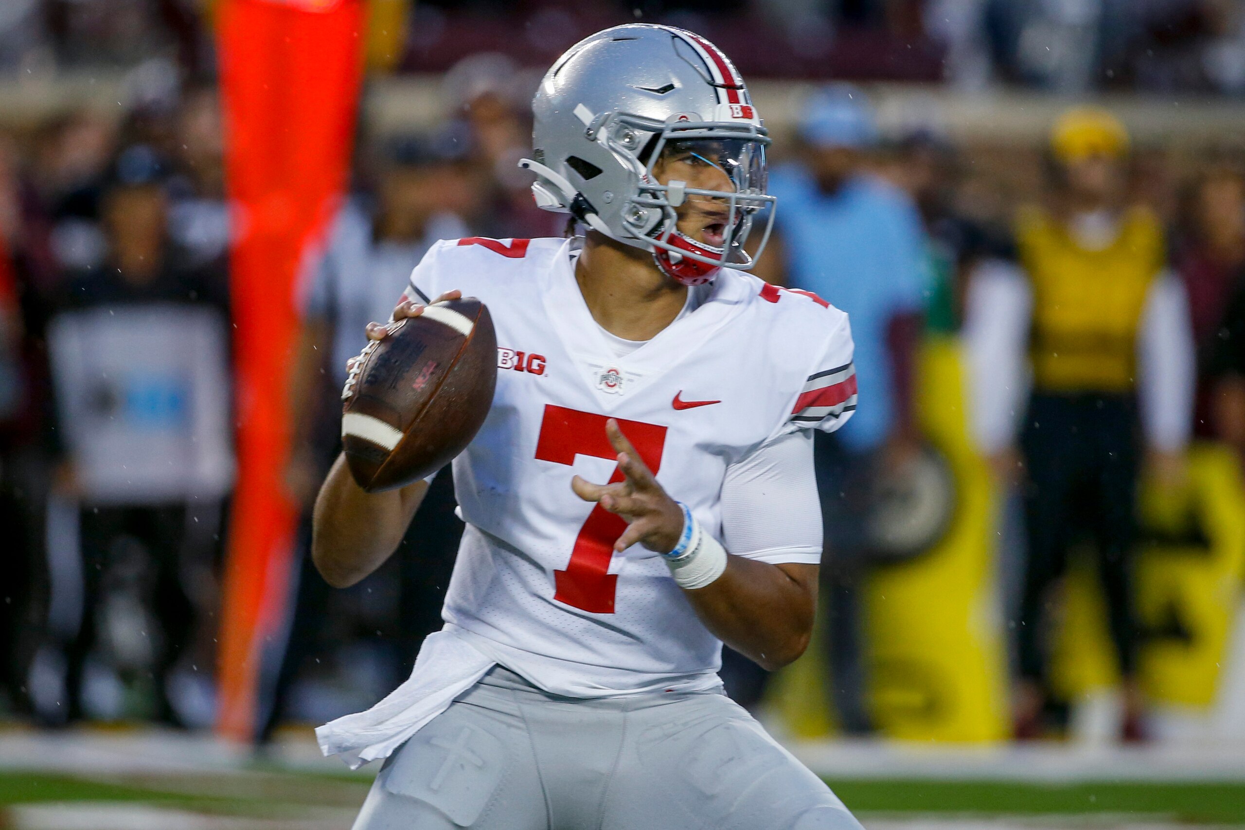 Ohio State quarterback C.J. Stroud (7) passes looks for a receiver during the first quarter of the team's NCAA college football game Thursday, Sept. 2, 2021, in Minneapolis. (AP Photo/Bruce Kluckhohn)