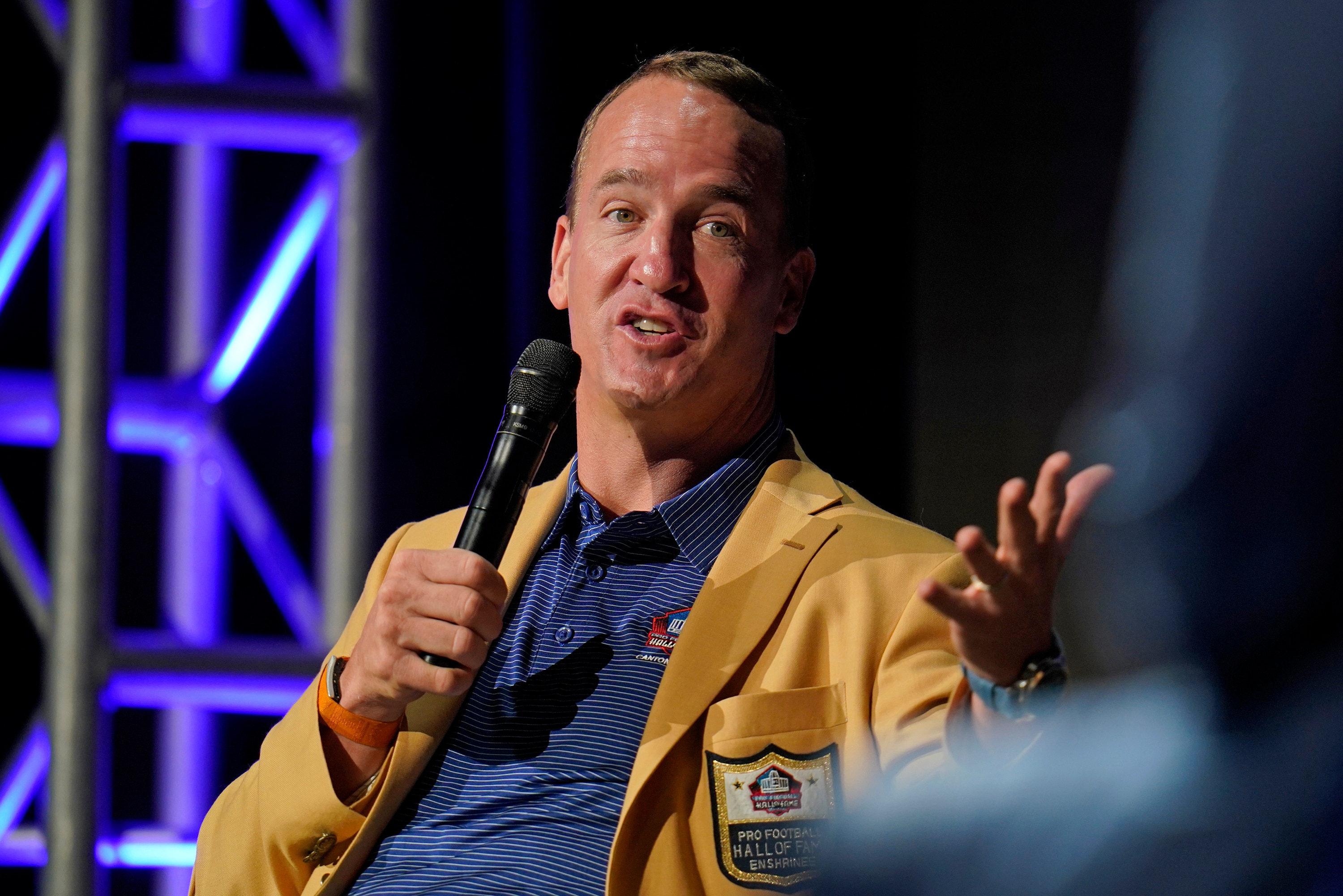 Peyton Manning answers a question, as members of the Pro Football Hall of Fame Class of 2021, participate in an enshrinees' roundtable in Canton, Ohio, Sunday, Aug. 8, 2021. (AP Photo/Gene J. Puskar)