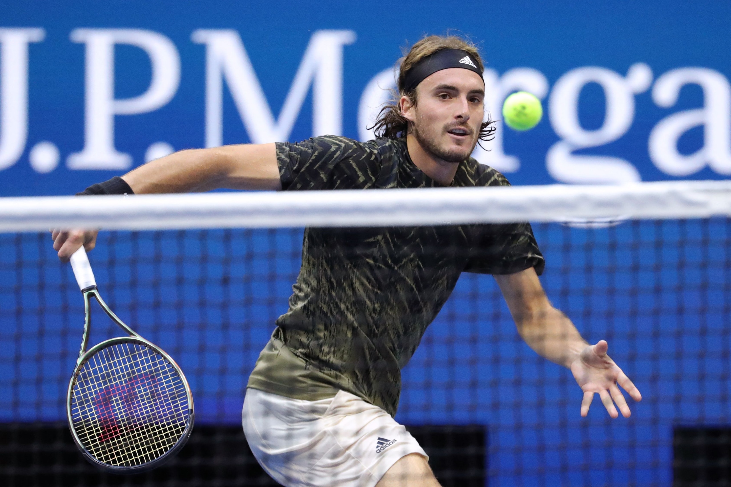 Greece's Stefanos Tsitsipas returns the ball to Spain's Carlos Alcaraz during their 2021 US Open Tennis tournament men's singles third round match at the USTA Billie Jean King National Tennis Center in New York, on September 3, 2021. (Photo by Kena Betancur / AFP) (Photo by KENA BETANCUR/AFP via Getty Images)
