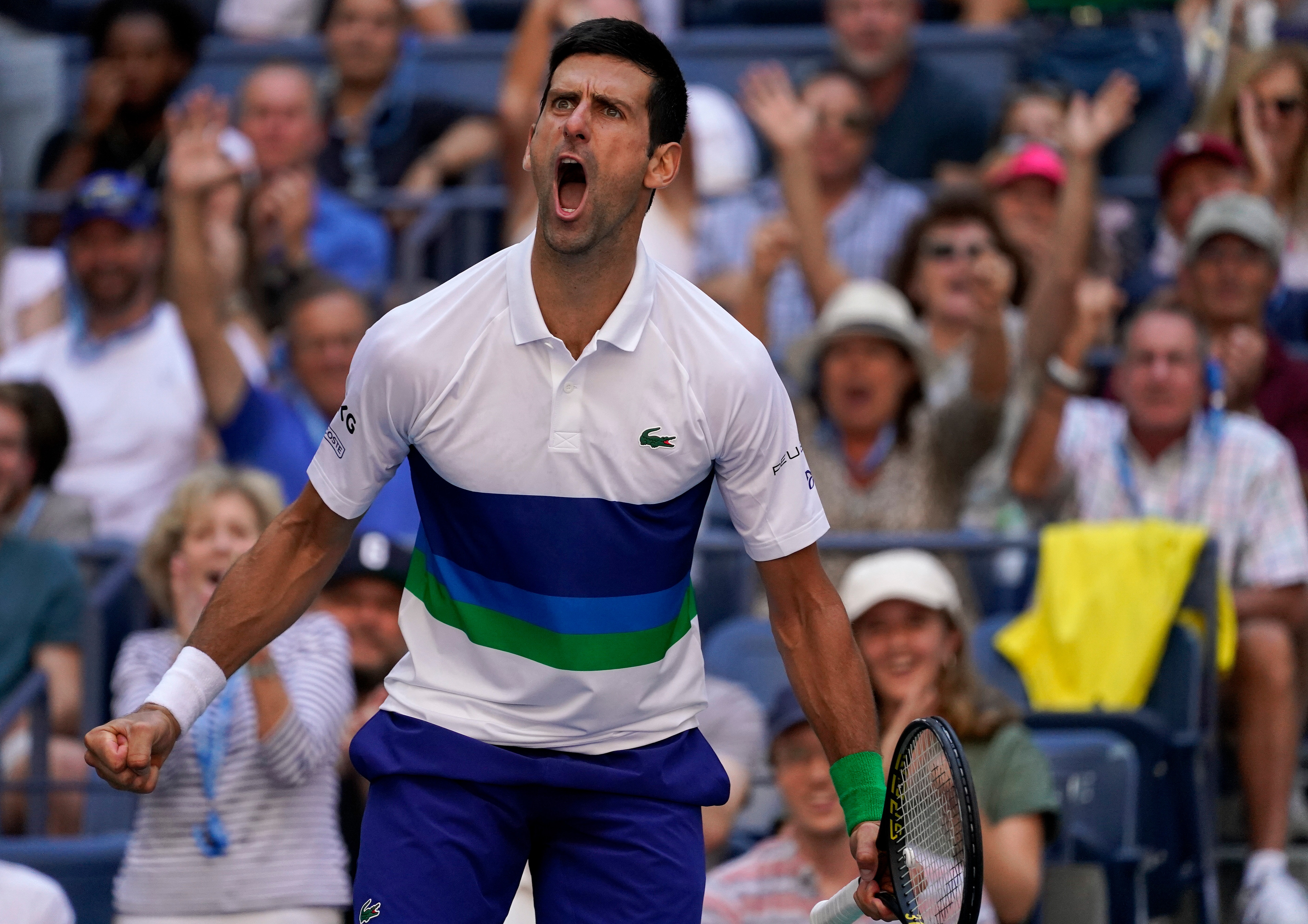 Novak Djokovic, of Serbia, reacts after scoring a point against Kei Nishikori, of Japan, during the third round of the US Open tennis championships, Saturday, Sept. 4, 2021, in New York. (AP Photo/John Minchillo)