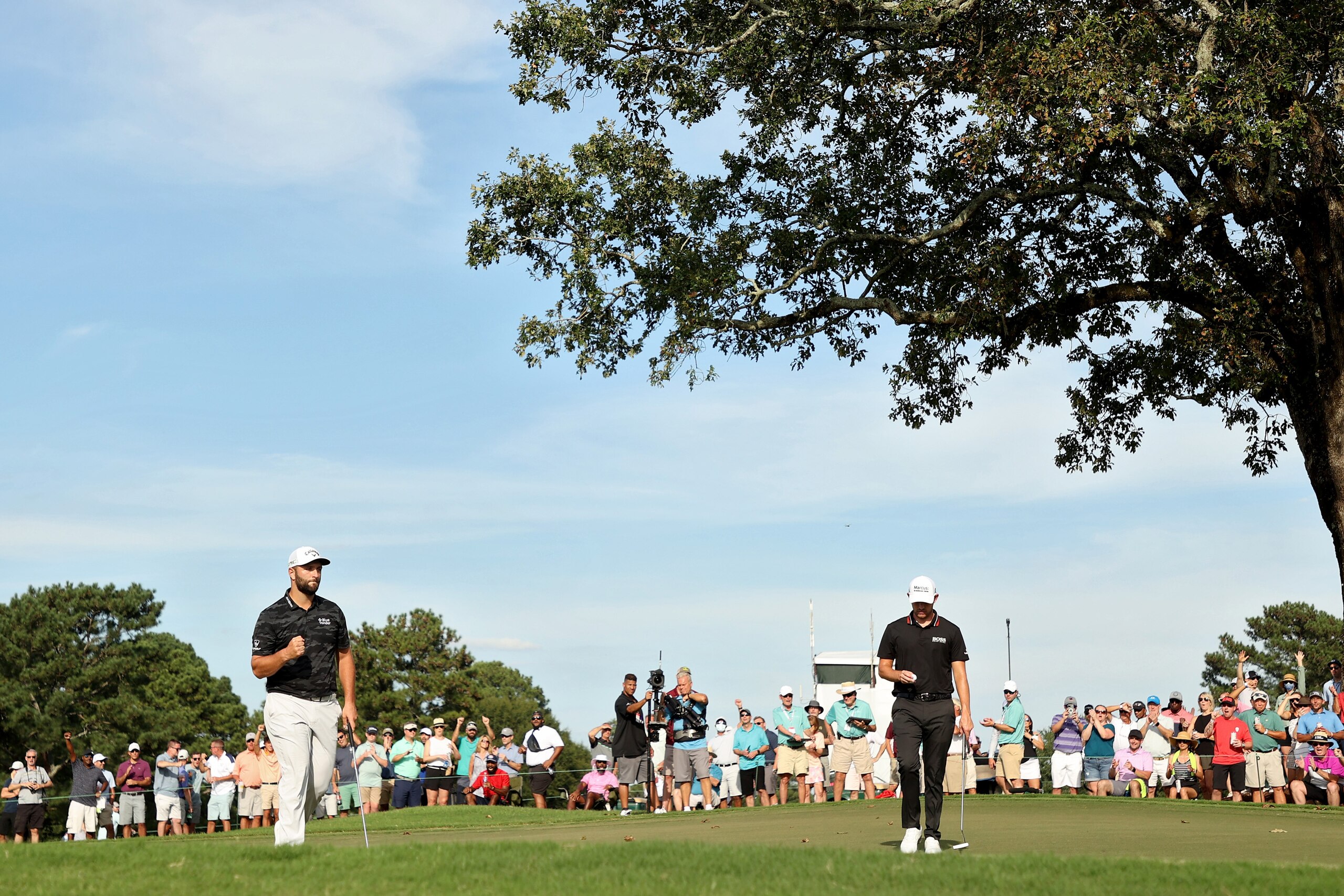 ATLANTA, GEORGIA - SEPTEMBER 04: Jon Rahm of Spain reacts after making birdie on the 13th hole during the third round of the TOUR Championship at East Lake Golf Club on September 04, 2021 in Atlanta, Georgia. (Photo by Cliff Hawkins/Getty Images)