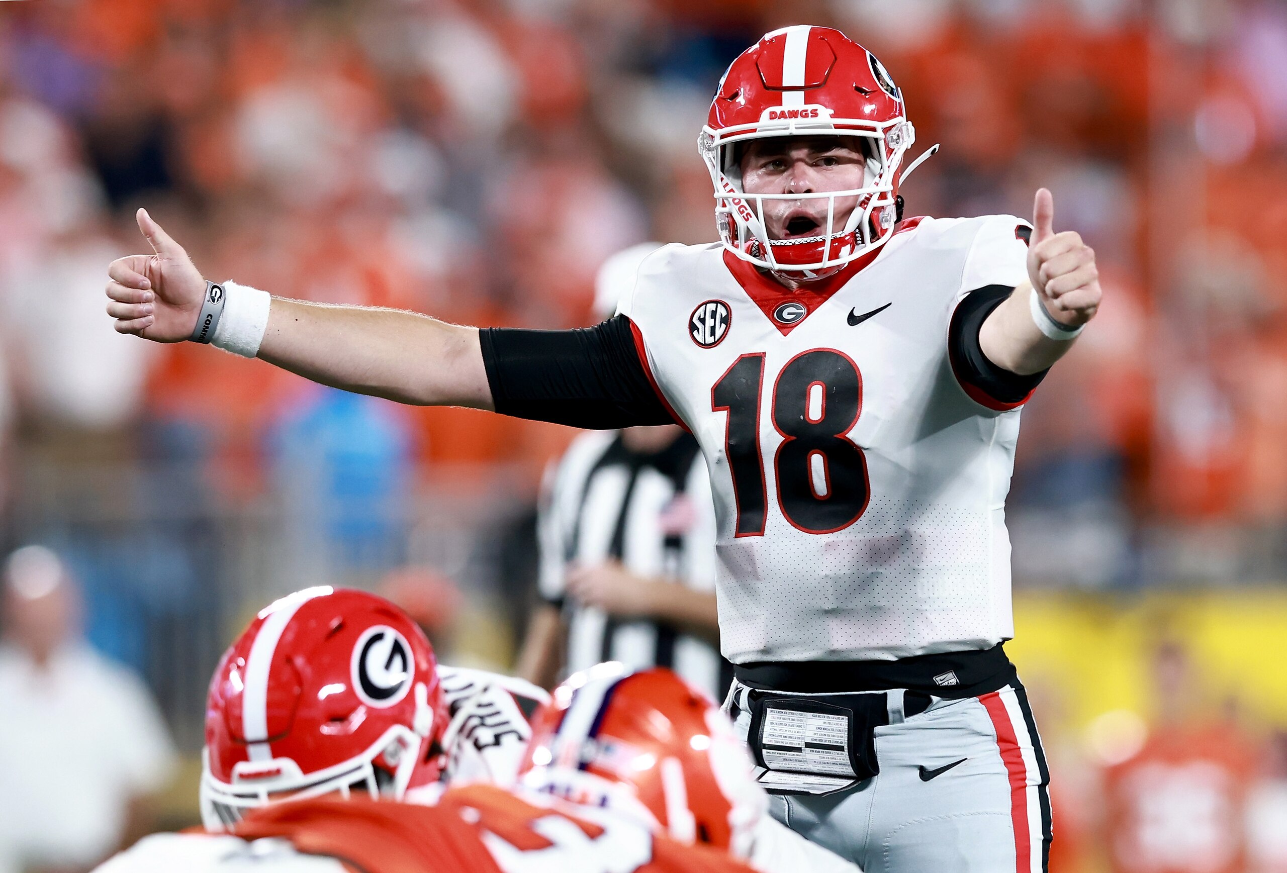 CHARLOTTE, NORTH CAROLINA - SEPTEMBER 04: JT Daniels #18 of the Georgia Bulldogs signals to the offense during the first half of their game against the Clemson Tigers at the Duke's Mayo Classic at Bank of America Stadium on September 04, 2021 in Charlotte, North Carolina. (Photo by Grant Halverson/Getty Images) CHARLOTTE, NORTH CAROLINA - SEPTEMBER 04: JT Daniels #18 of the Georgia Bulldogs signals to the offense during the first half of their game against the Clemson Tigers at the Duke's Mayo Classic at Bank of America Stadium on September 04, 2021 in Charlotte, North Carolina. (Photo by Grant Halverson/Getty Images)