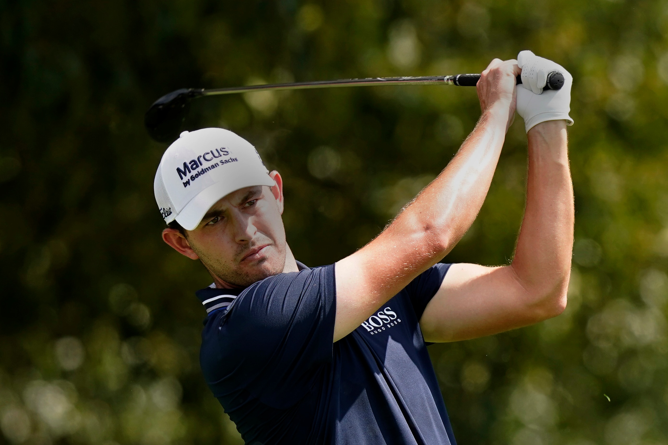 Patrick Cantlay hits from the tee on the third hole during the final round of play in the Tour Championship golf tournament at East Lake Golf Club, Sunday, Sept. 5, 2021, in Atlanta. (AP Photo/Brynn Anderson)
