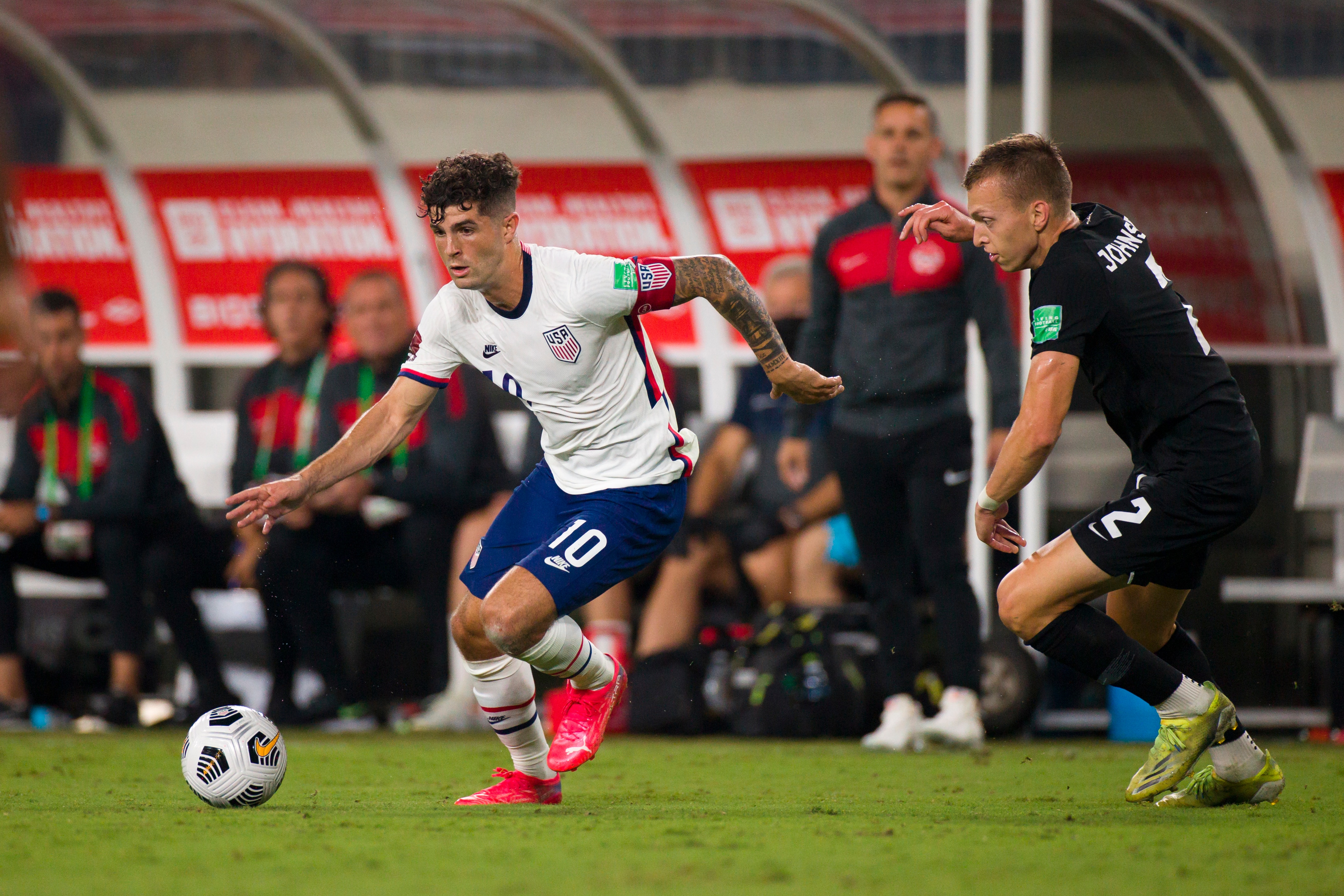 NASHVILLE, TN - SEPTEMBER 05:  Alistair Johnston #2 of Canada challenges Christian Pulisic #10 of United States as he dribbles towards net during the first half of a World Cup qualifying match at Nissan Stadium on September 5, 2021 in Nashville, Tennessee. (Photo by Brett Carlsen/Getty Images)