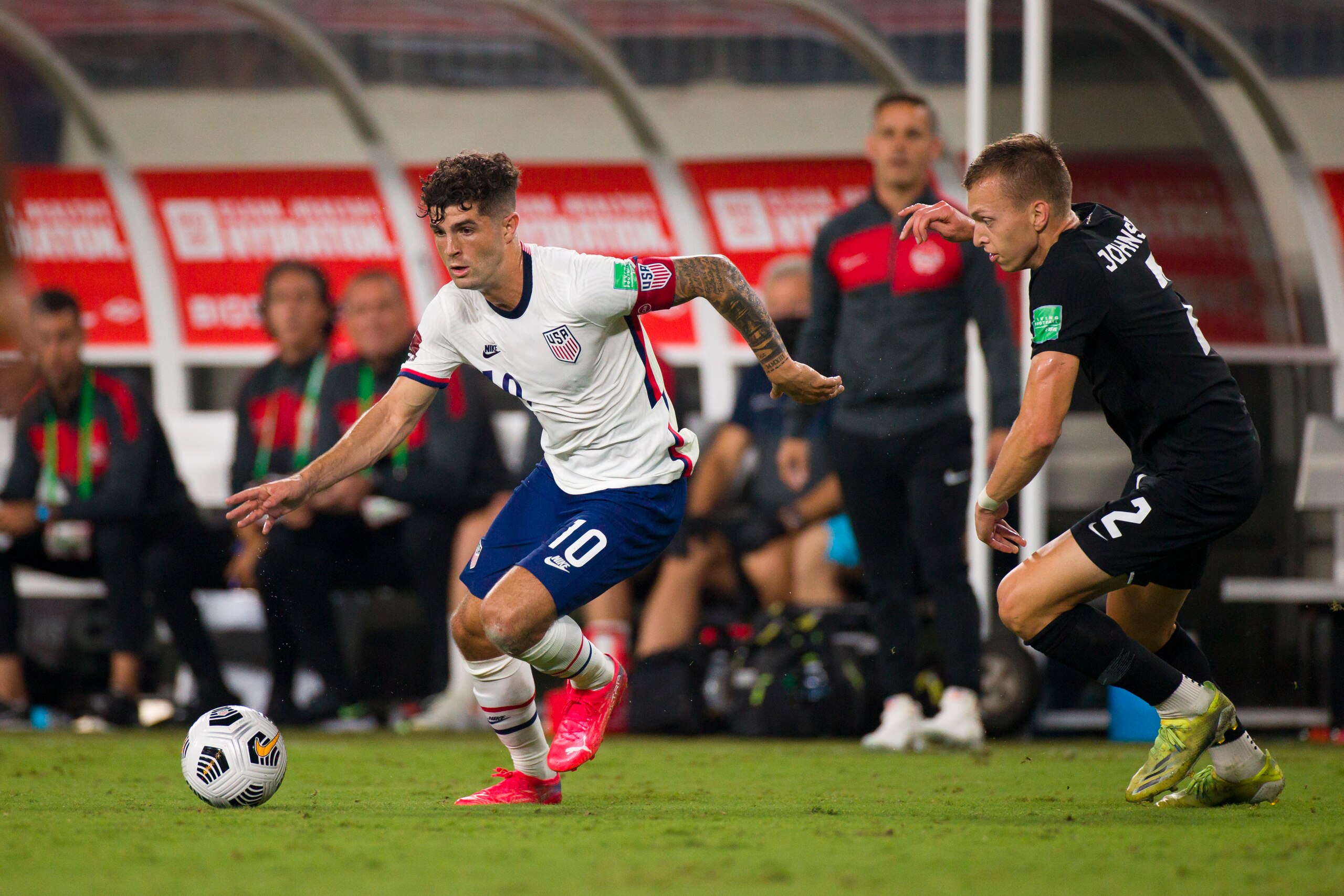 NASHVILLE, TN - SEPTEMBER 05:  Alistair Johnston #2 of Canada challenges Christian Pulisic #10 of United States as he dribbles towards net during the first half of a World Cup qualifying match at Nissan Stadium on September 5, 2021 in Nashville, Tennessee. (Photo by Brett Carlsen/Getty Images)