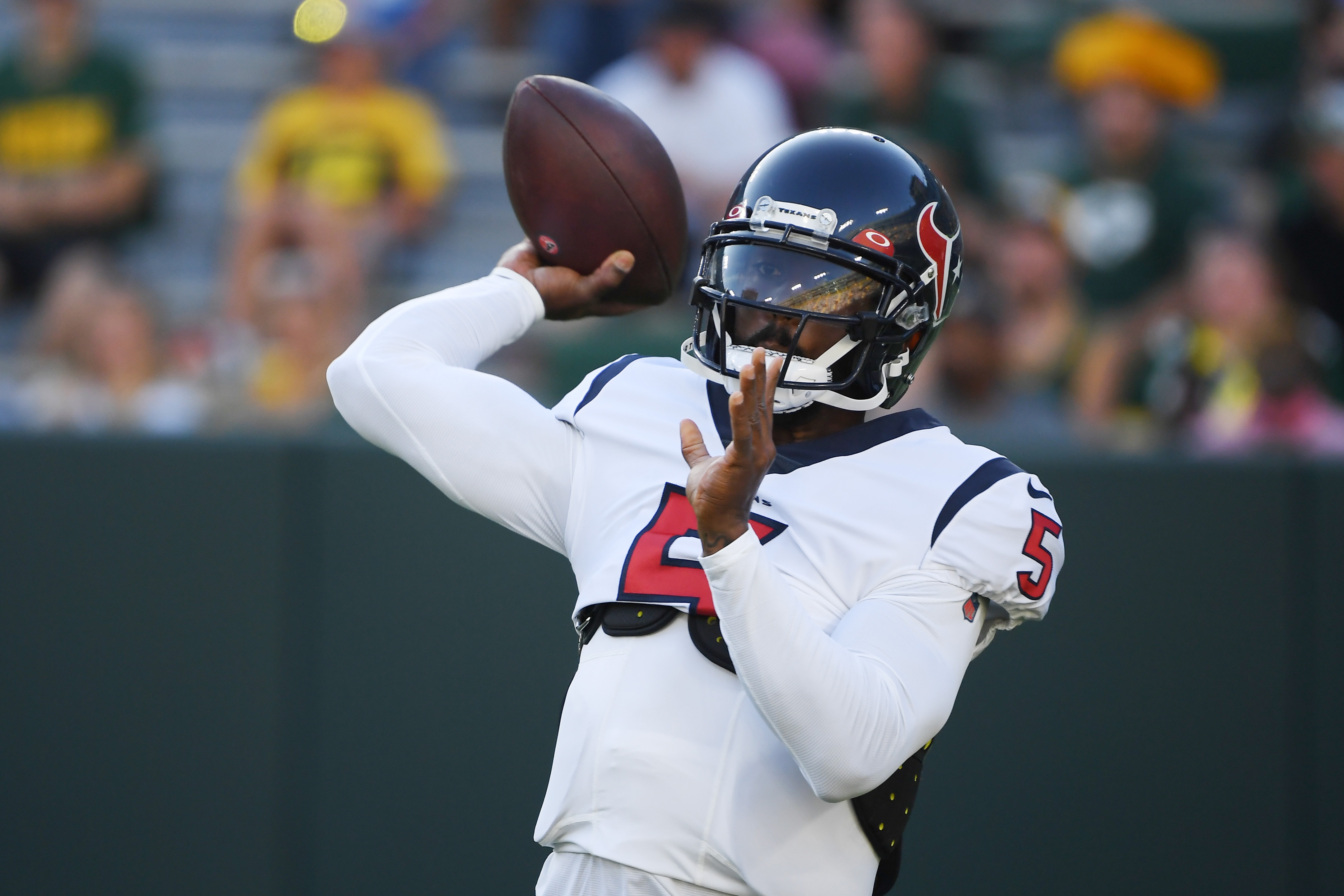 GREEN BAY, WISCONSIN - AUGUST 14: Tyrod Taylor #5 of the Houston Texans warms up before the preseason game against the Green Bay Packers at Lambeau Field on August 14, 2021 in Green Bay, Wisconsin. (Photo by Quinn Harris/Getty Images)
