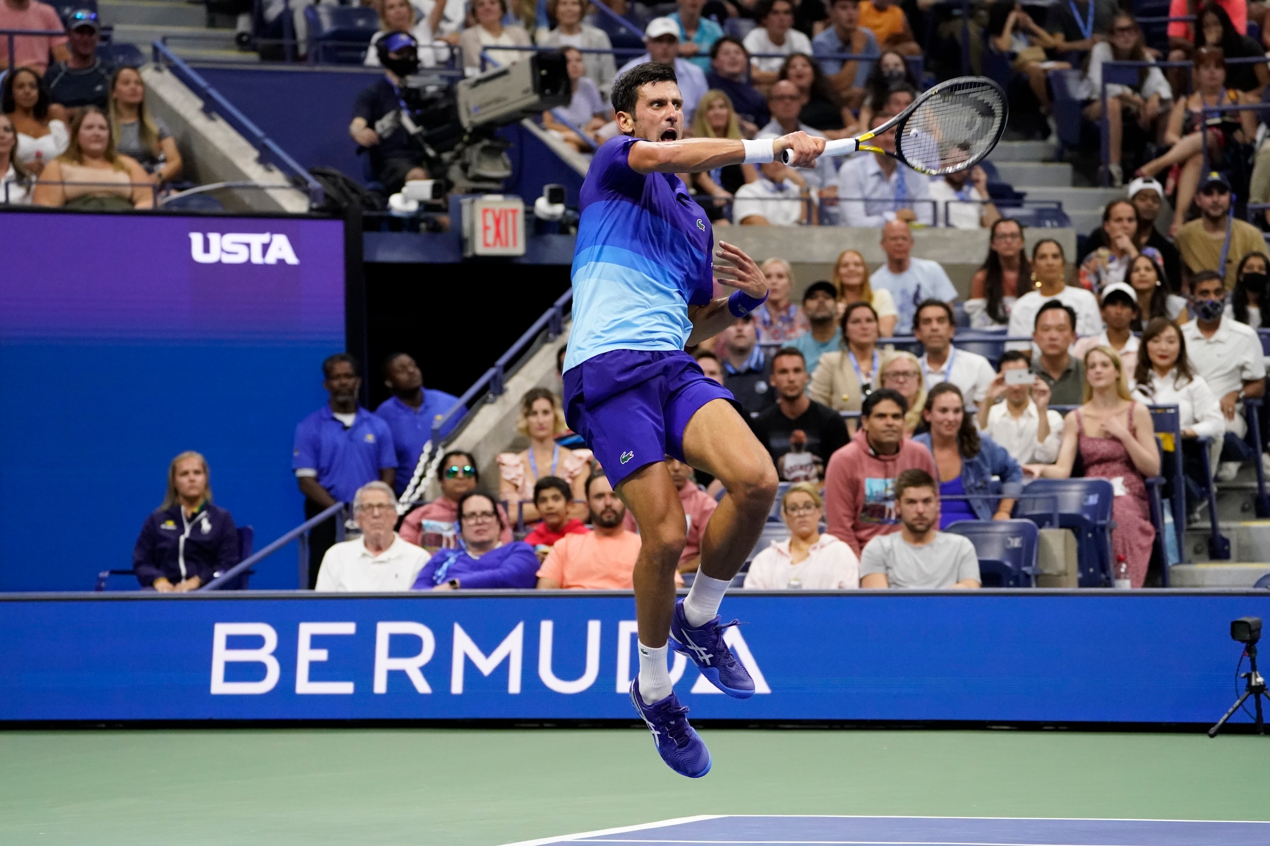 Novak Djokovic, of Serbia, returns against Jenson Brooksby, of the United States, during the fourth round of the US Open tennis championships, Monday, Sept. 6, 2021, in New York. (AP Photo/John Minchillo)