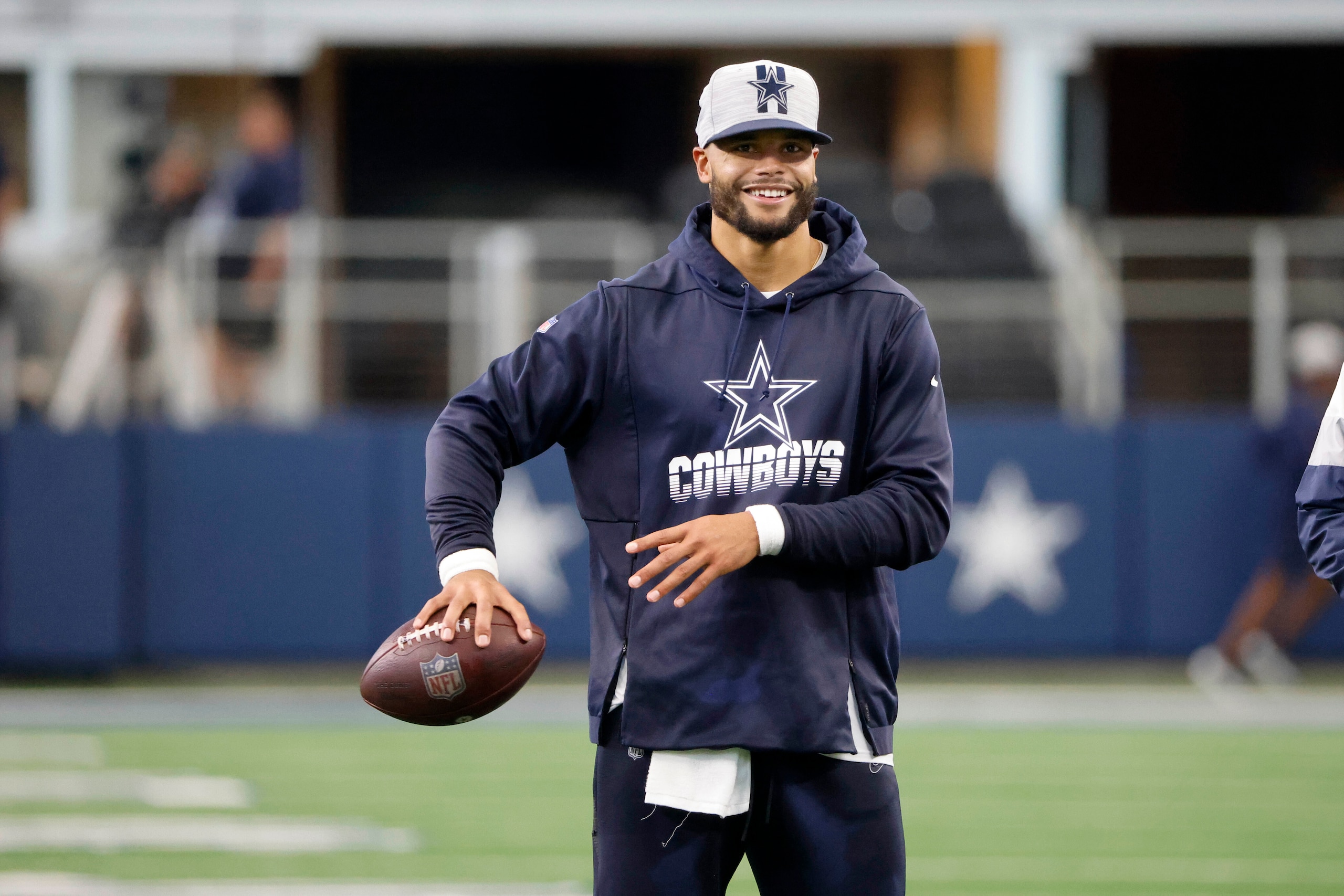 Dallas Cowboys quarterback Dak Prescott throws a football before the first half of a preseason NFL football game against the Houston Texans in Arlington, Texas, Saturday, Aug. 21,2021. (AP Photo/Michael Ainsworth) Dallas Cowboys quarterback Dak Prescott throws a football before the first half of a preseason NFL football game against the Houston Texans in Arlington, Texas, Saturday, Aug. 21,2021. (AP Photo/Michael Ainsworth)