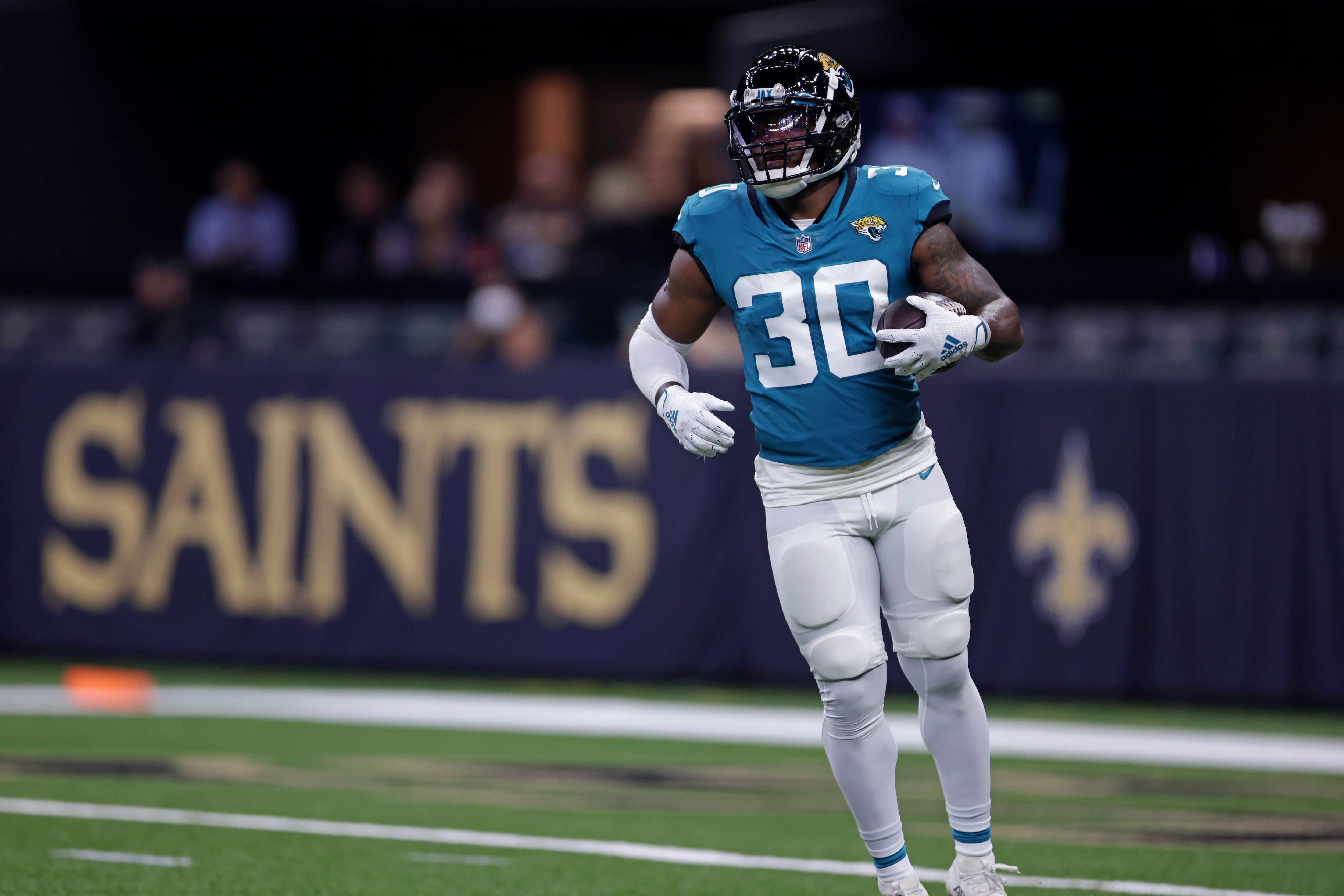 Jacksonville Jaguars running back James Robinson (30) warms up before an NFL preseason football game against the New Orleans Saints in New Orleans, Monday, Aug. 23, 2021. (AP Photo/Brett Duke)