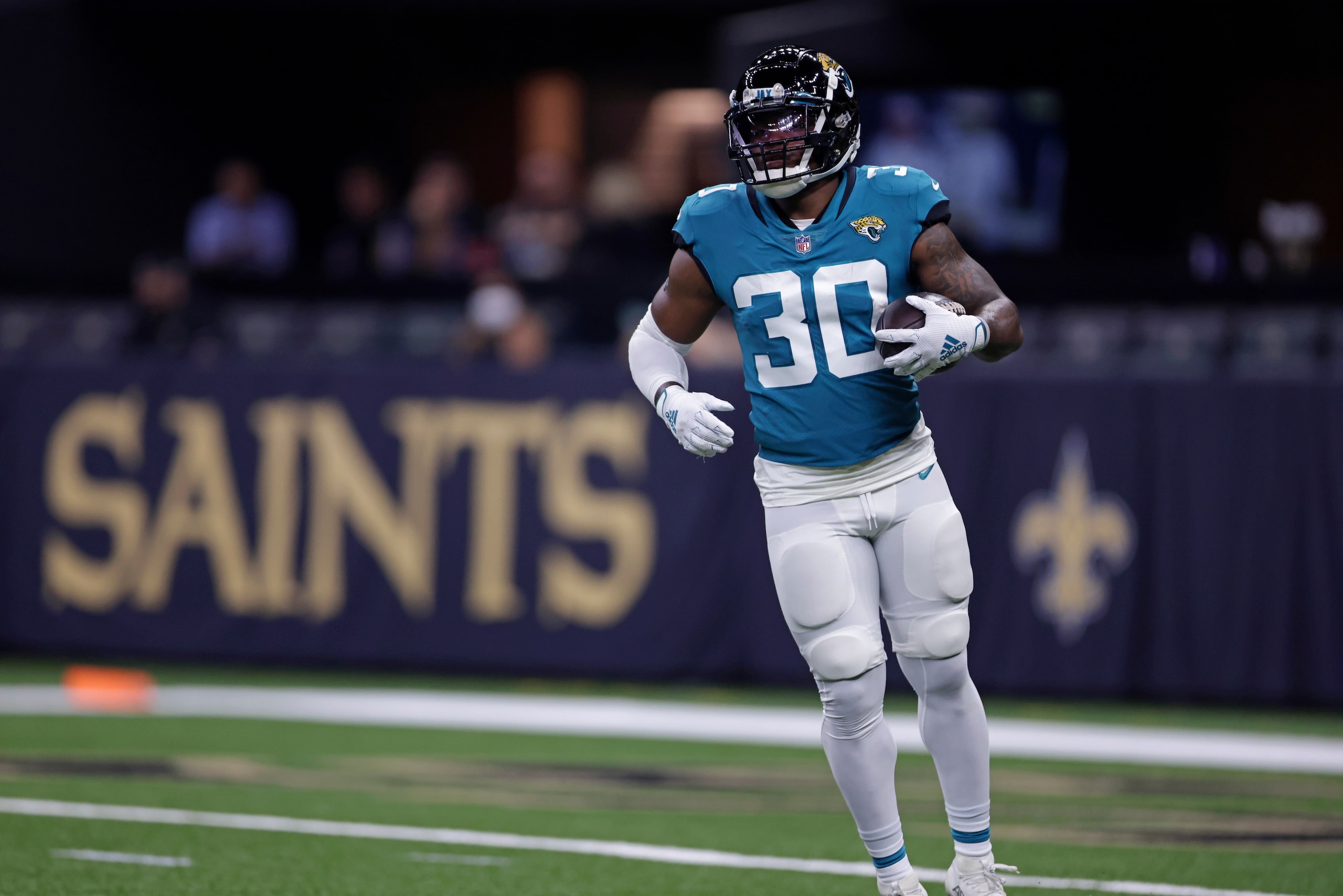 Jacksonville Jaguars running back James Robinson (30) warms up before an NFL preseason football game against the New Orleans Saints in New Orleans, Monday, Aug. 23, 2021. (AP Photo/Brett Duke)