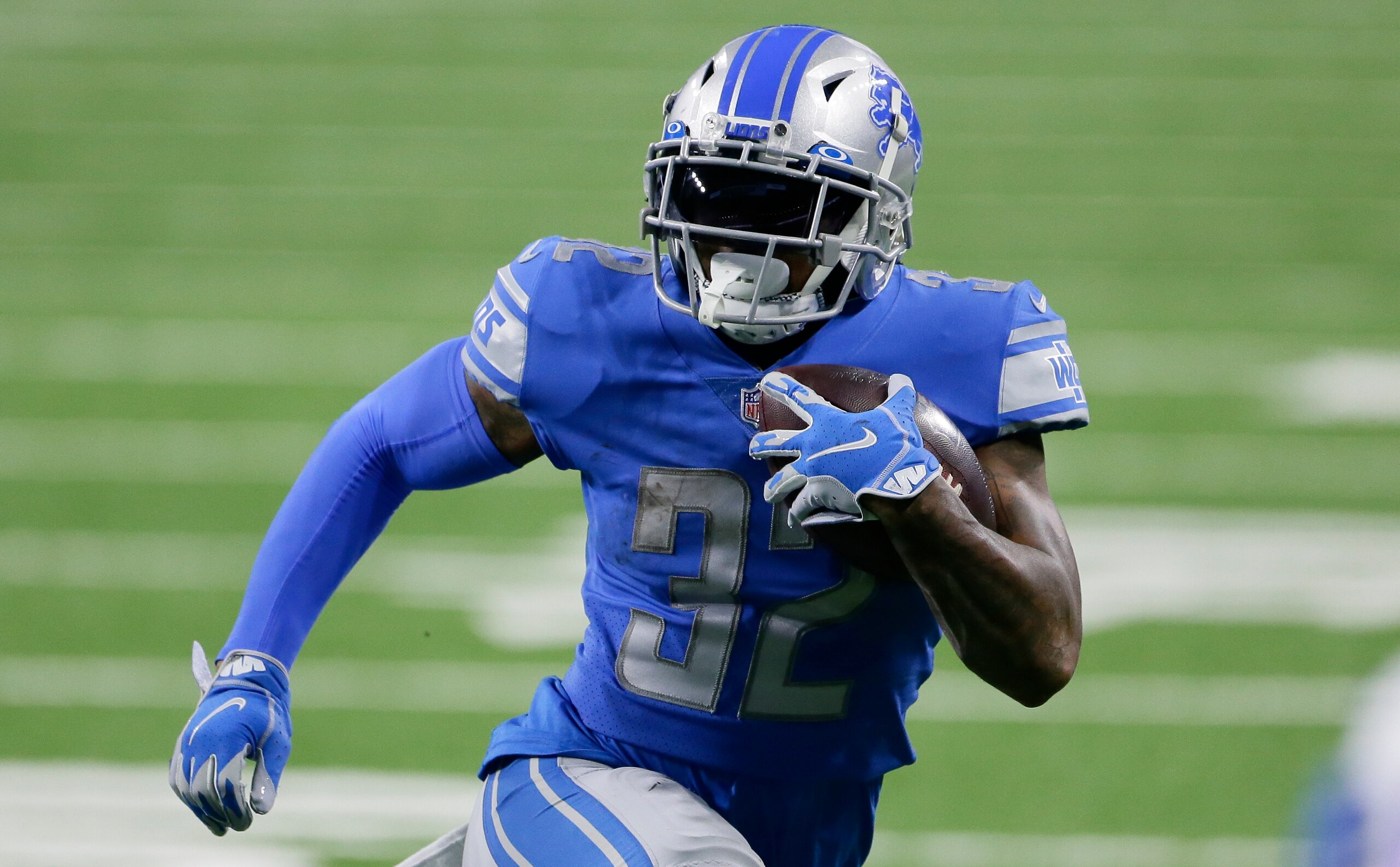 Detroit Lions running back D'Andre Swift (32) carries the ball against the Minnesota Vikings during the second half of an NFL football game, Sunday, Jan. 3, 2021, in Detroit. (AP Photo/Duane Burleson)