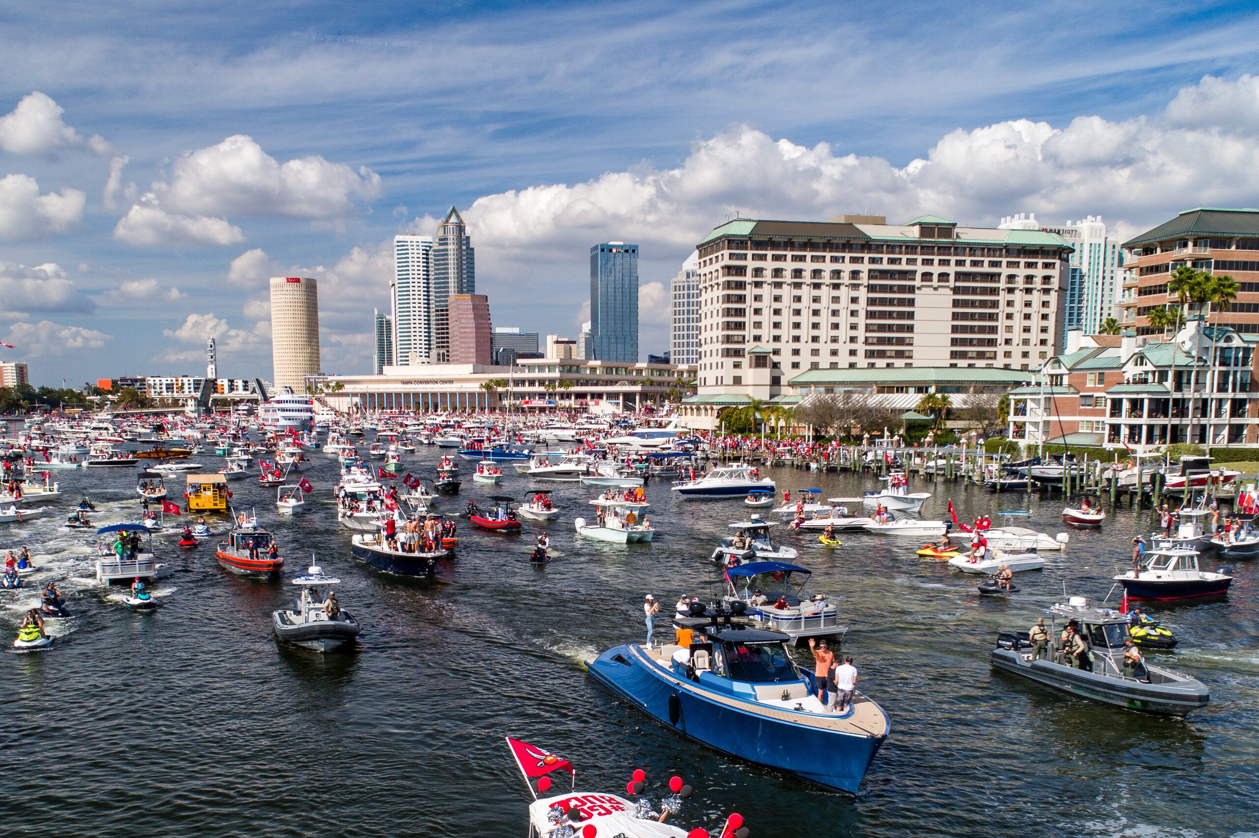 TAMPA, FLORIDA - FEBRUARY 10: In an aerial view from a drone, Tom Brady of the Tampa Bay Buccaneers waves to fans during the Tampa Bay Buccaneers Super Bowl Victory Boat Parade on the Hillborough river on February 10, 2021 in Tampa, Florida. (Photo by Julio Aguilar/Getty Images)