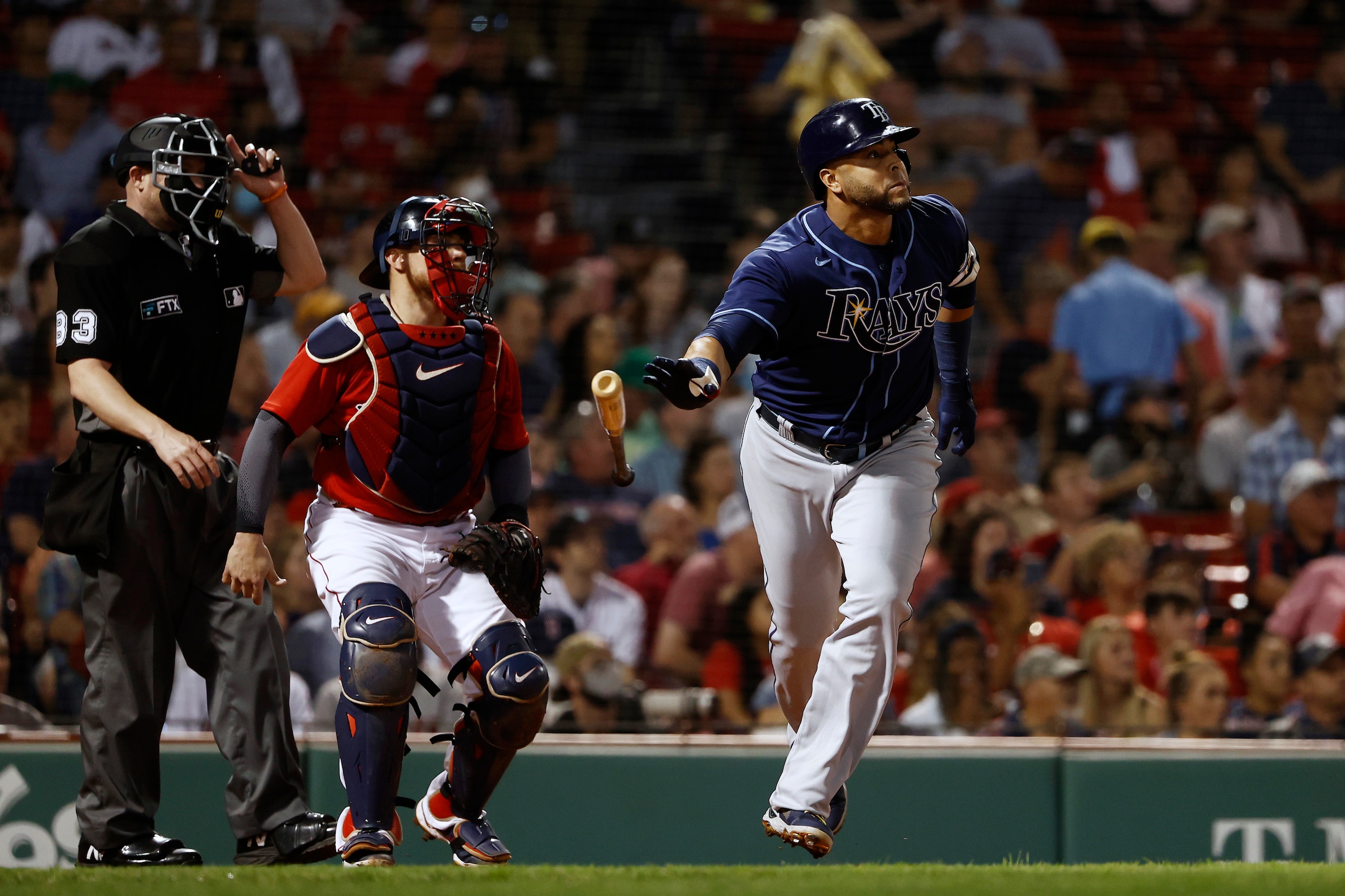Tampa Bay Rays' Nelson Cruz tosses his bat as he watches his two-run home run during the third inning of the team's baseball game against the Boston Red Sox on Tuesday, Sept. 7, 2021, at Fenway Park in Boston. (AP Photo/Winslow Townson)