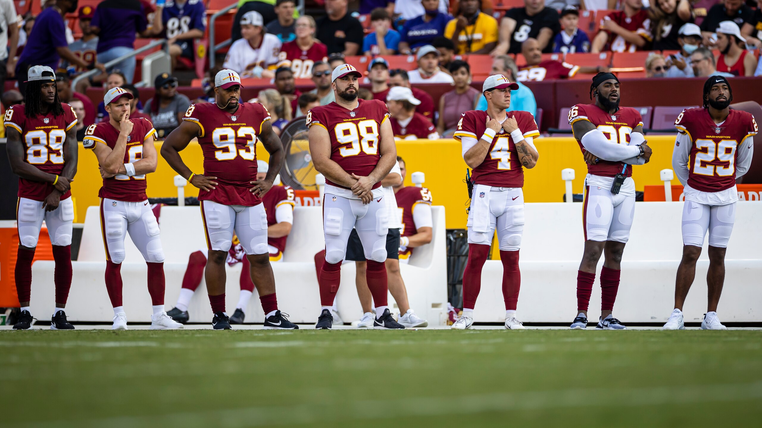 LANDOVER, MD - AUGUST 28: Washington Football Team players watch play during the first half as they sit out of the preseason game against the Baltimore Ravens at FedExField on August 28, 2021 in Landover, Maryland. (Photo by Scott Taetsch/Getty Images)