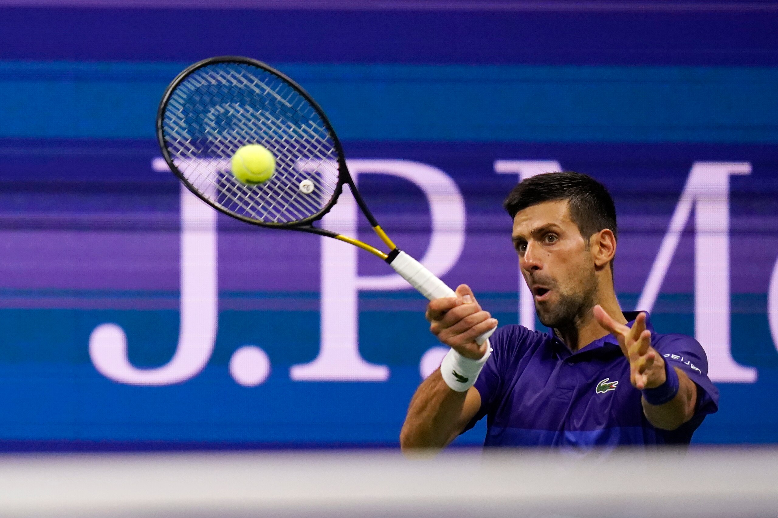 Novak Djokovic, of Serbia, returns to Matteo Berrettini, of Italy, during the quarterfinals of the U.S. Open tennis tournament Wednesday, Sept. 8, 2021, in New York. (AP Photo/Frank Franklin II)