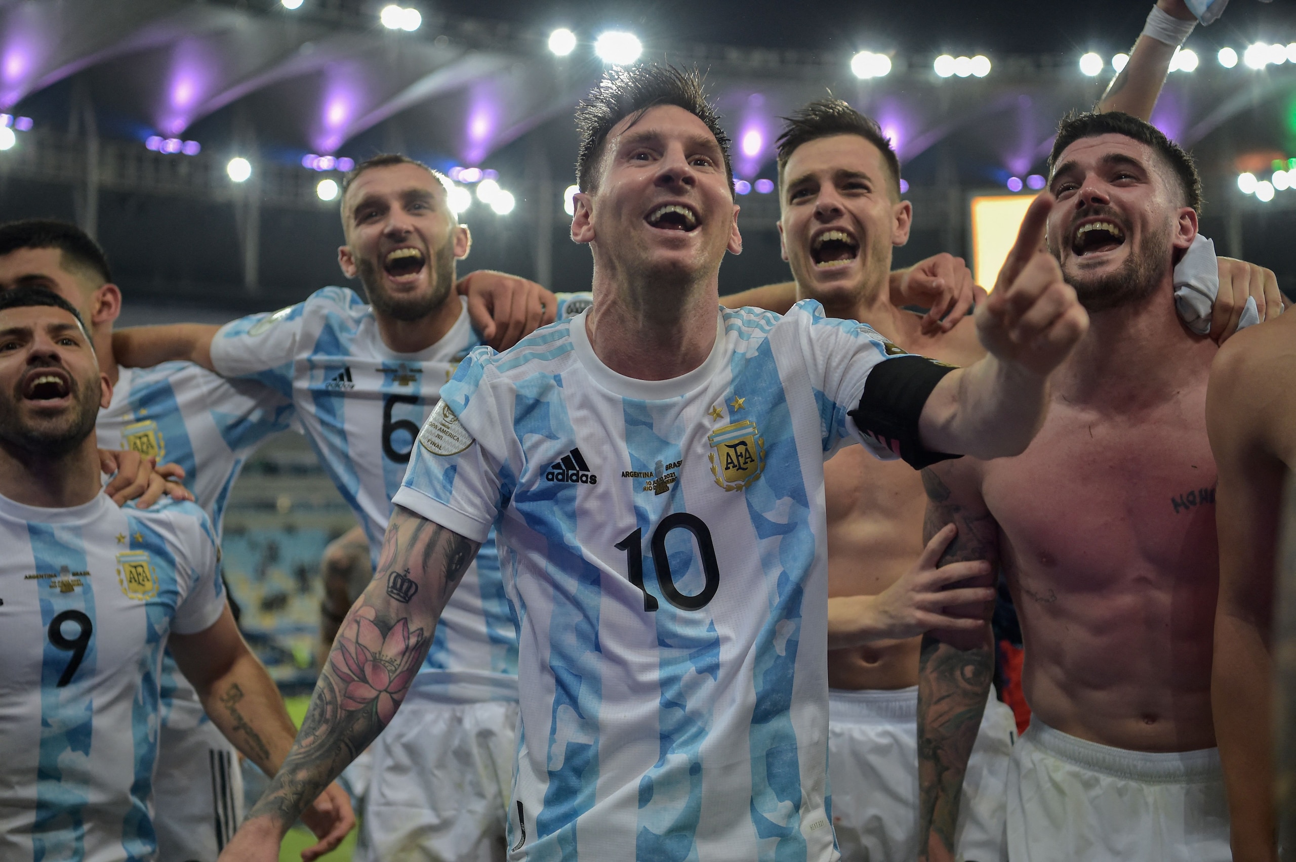 Argentina's Lionel Messi (C) and teammates celebrate after winning the Conmebol 2021 Copa America football tournament final match against Brazil at Maracana Stadium in Rio de Janeiro, Brazil, on July 10, 2021. - Argentina won 1-0. (Photo by CARL DE SOUZA / AFP) (Photo by CARL DE SOUZA/AFP via Getty Images) Argentina's Lionel Messi (C) and teammates celebrate after winning the Conmebol 2021 Copa America football tournament final match against Brazil at Maracana Stadium in Rio de Janeiro, Brazil, on July 10, 2021. - Argentina won 1-0. (Photo by CARL DE SOUZA / AFP) (Photo by CARL DE SOUZA/AFP via Getty Images)