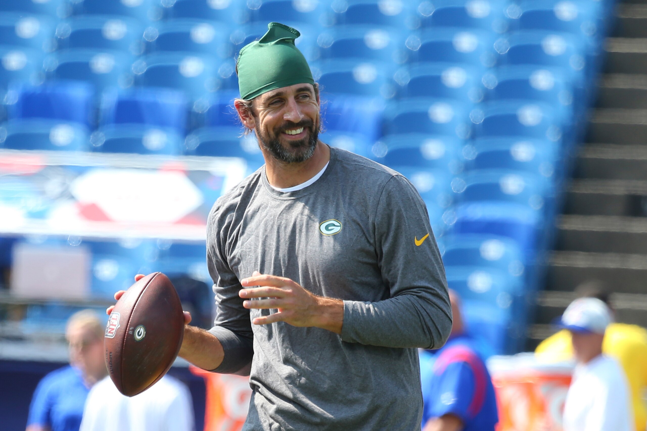 Green Bay Packers quarterback Aaron Rodgers smiles as he warms up prior to the start of the first half of a preseason NFL football game against the Buffalo Bills, Saturday, Aug. 28, 2021, in Orchard Park, N.Y. (AP Photo/Jeffrey T. Barnes)