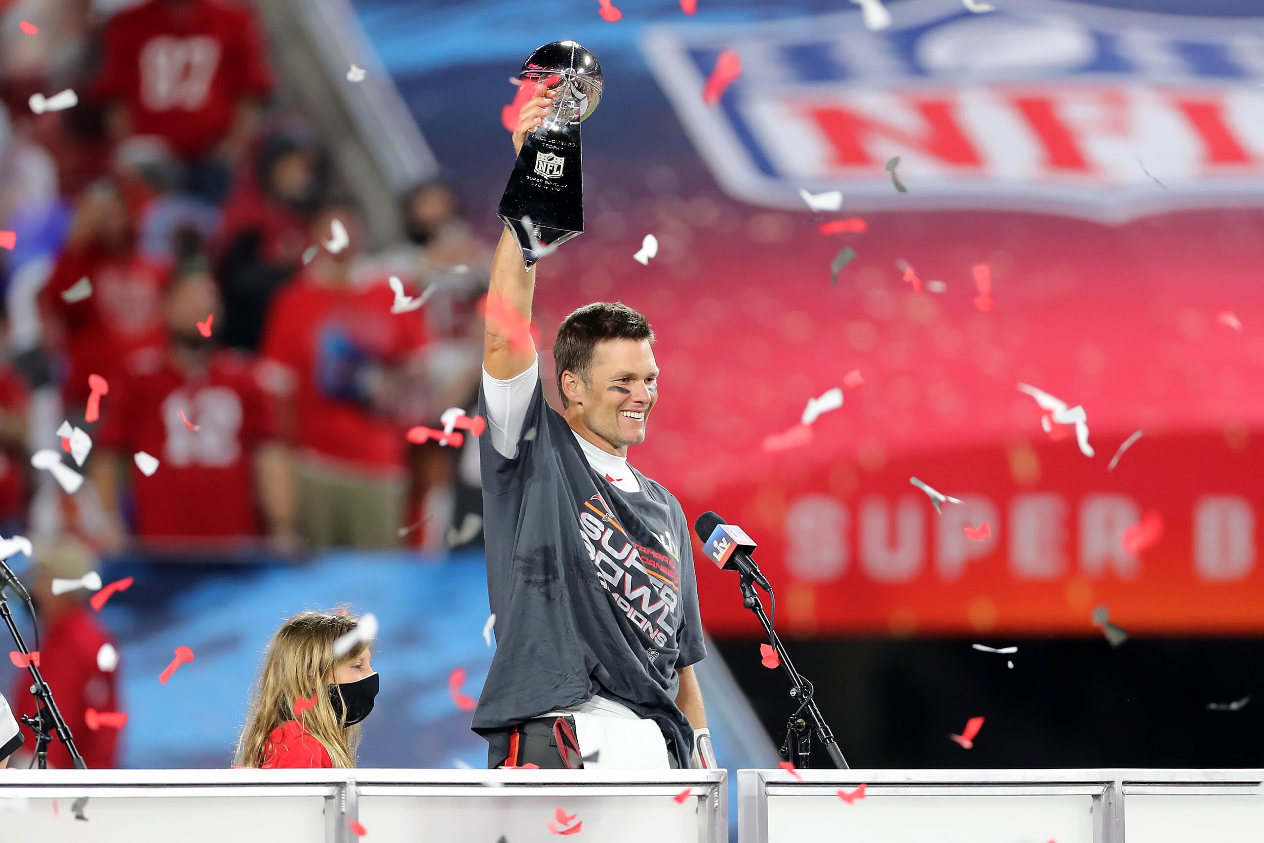 TAMPA, FL - FEBRUARY 07: Super Bowl MVP Tom Brady (12) of the Buccaneers hoists the Lombardi Trophy after the Super Bowl LV game between the Kansas City Chiefs and the Tampa Bay Buccaneers on February 7, 2021 at Raymond James Stadium, in Tampa, FL. (Photo by Cliff Welch/Icon Sportswire via Getty Images)