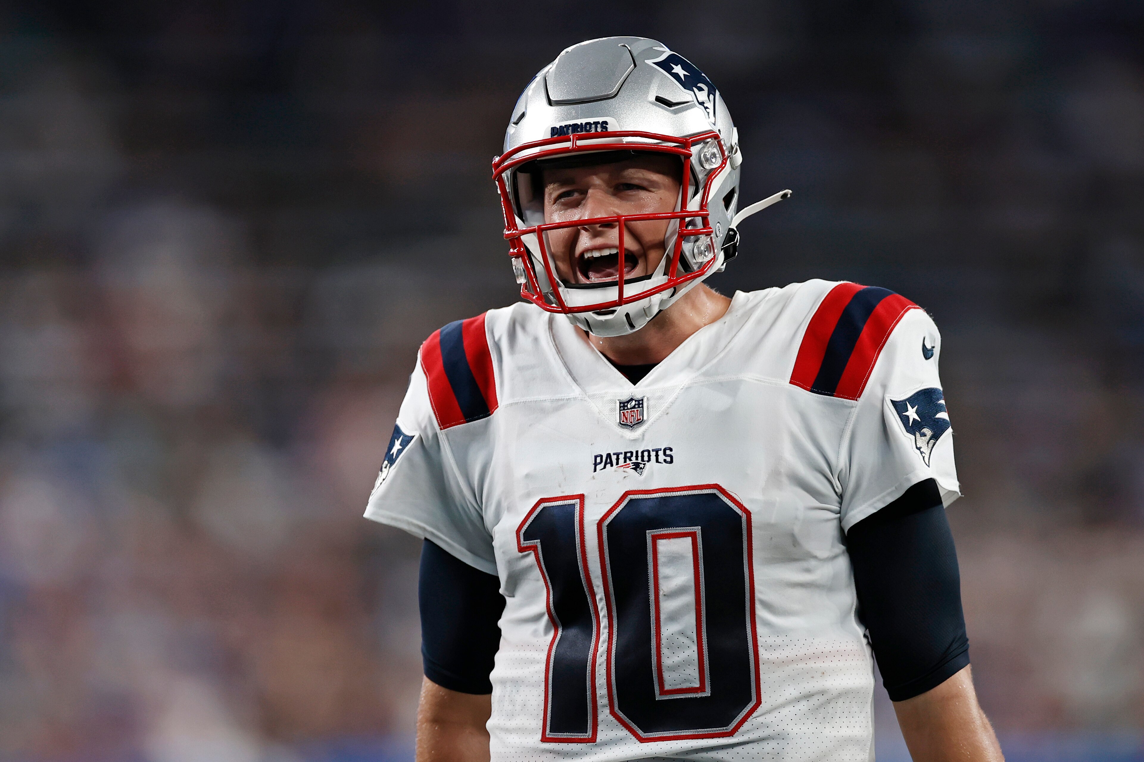 New England Patriots quarterback Mac Jones (10) reacts against the New York Giants during an NFL preseason football game, Sunday, Aug. 29, 2021, in East Rutherford, N.J. (AP Photo/Adam Hunger)