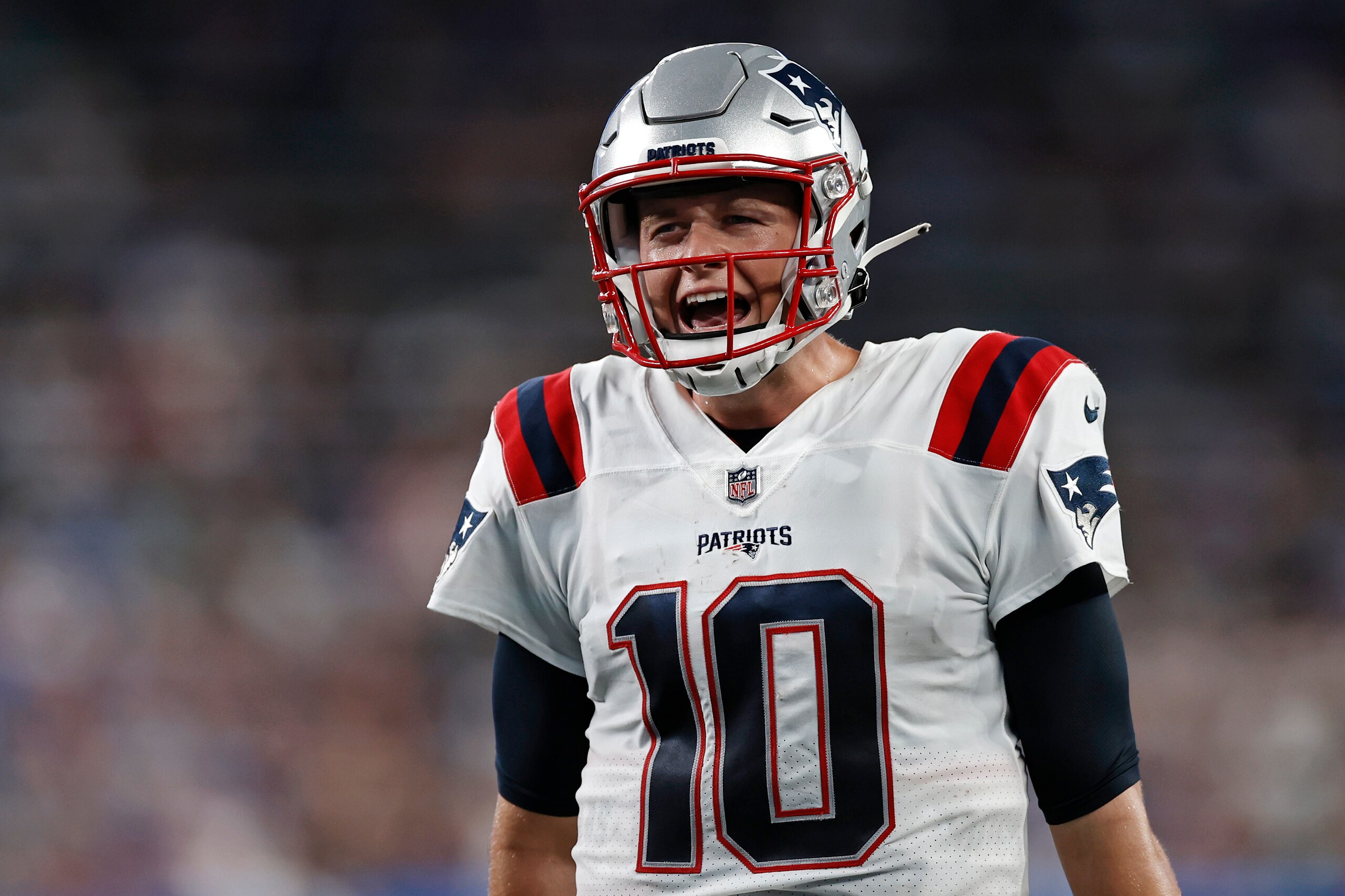 New England Patriots quarterback Mac Jones (10) reacts against the New York Giants during an NFL preseason football game, Sunday, Aug. 29, 2021, in East Rutherford, N.J. (AP Photo/Adam Hunger)