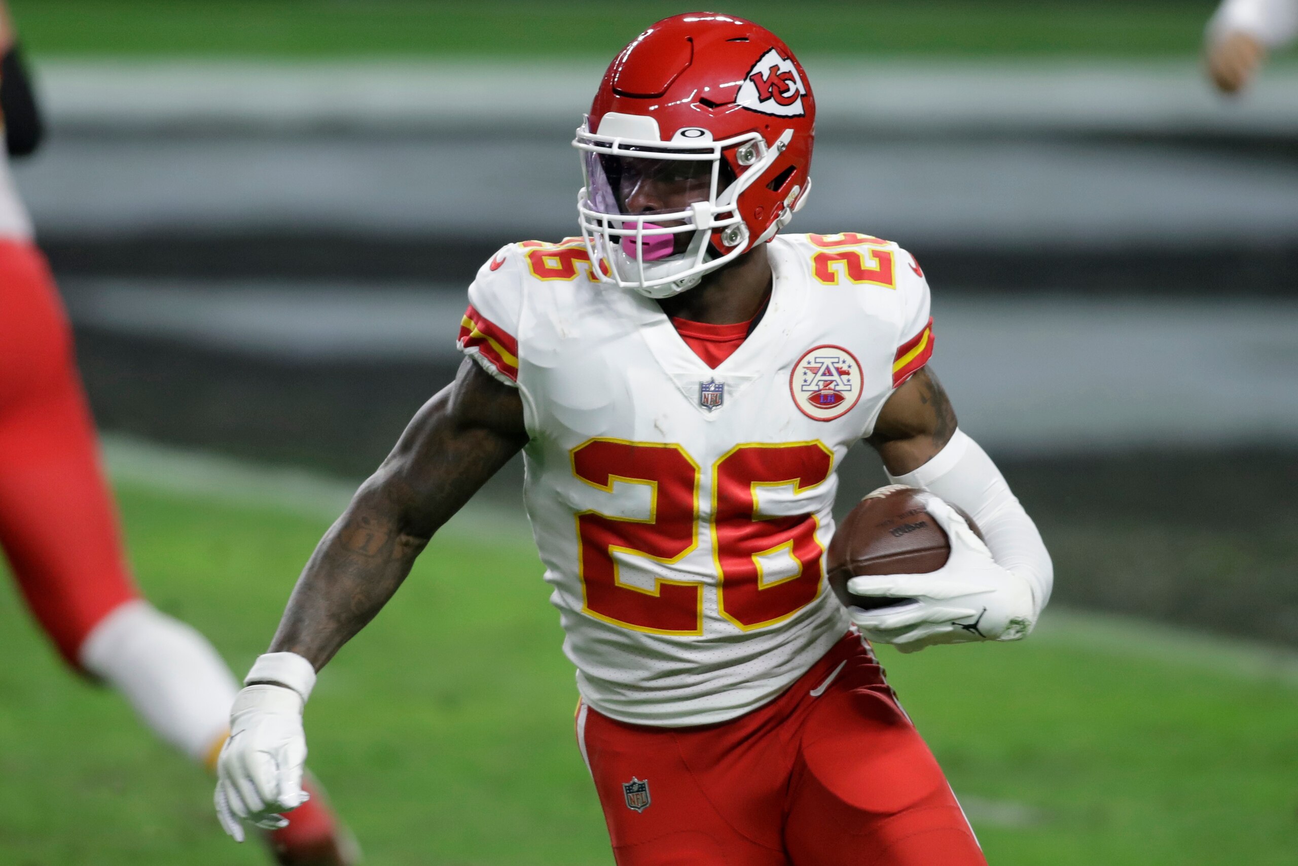 Kansas City Chiefs running back Le'Veon Bell (26) runs with the ball against the Las Vegas Raiders during the first half of an NFL football game, Sunday, Nov. 22, 2020, in Las Vegas. (AP Photo/Isaac Brekken)