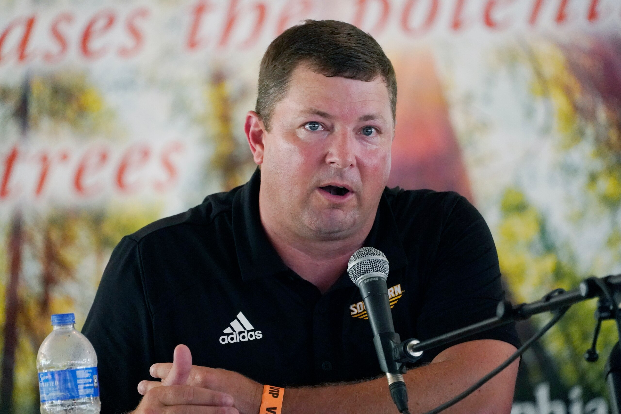Southern Mississippi football coach Will Hall joined Lane Kiffin of Mississippi, and Mike Leach of Mississippi State, unseen, in participating in a special "Football at the Fair" program at the Neshoba County Fair in Philadelphia, Miss., Thursday, July 29, 2021. The three Mississippi NCAA Division 1 football coaches discussed their programs' future, joked with each other and answered audience's questions in the hour long program. The fair, also known as Mississippi's Giant House Party, is an annual event of agricultural, political, and social entertainment at what might be the country's largest campground fair. (AP Photo/Rogelio V. Solis)