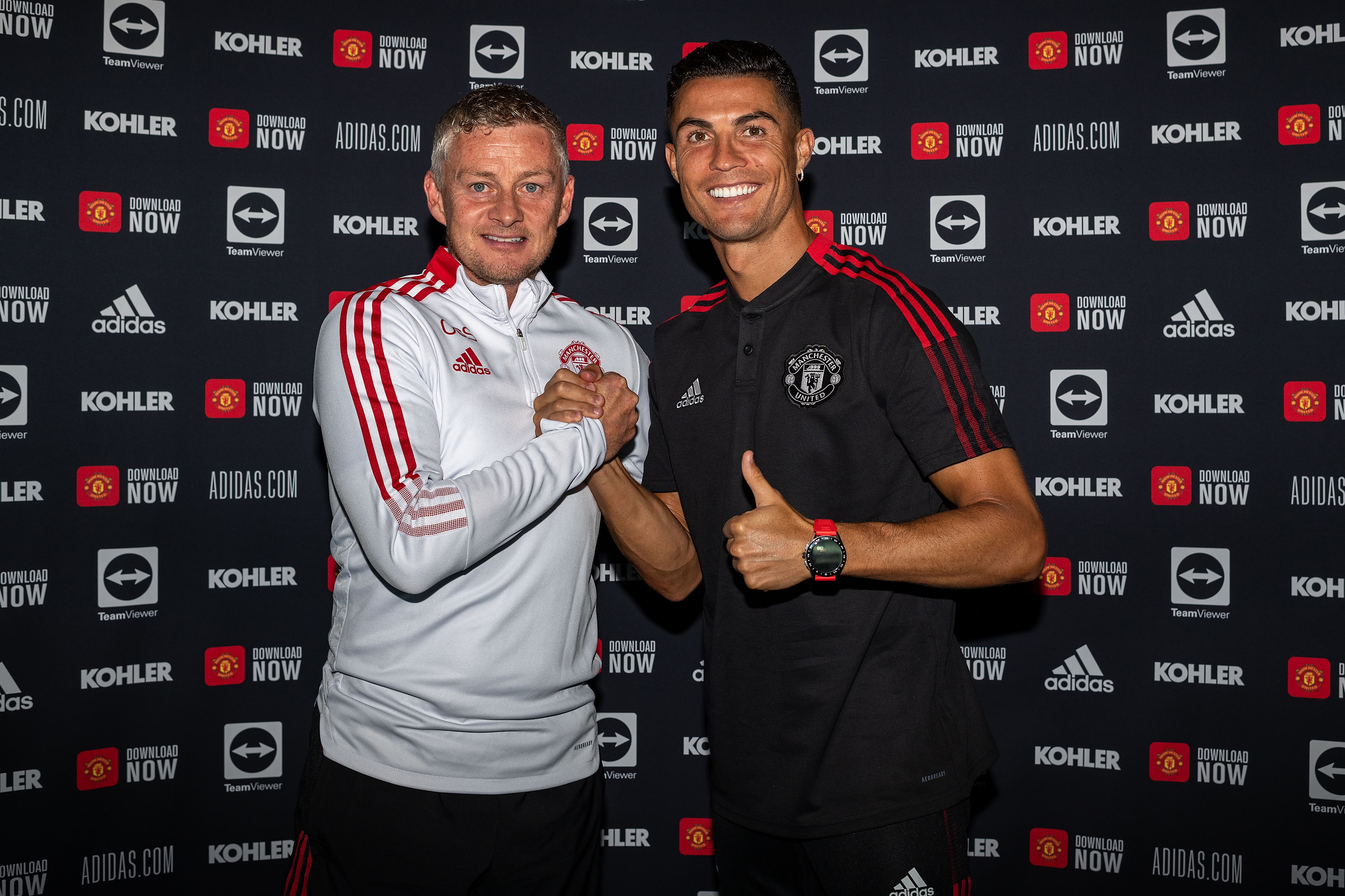 MANCHESTER, ENGLAND - SEPTEMBER 08: (EXCLUSIVE COVERAGE) Cristiano Ronaldo of Manchester United poses with Manager Ole Gunnar Solskjaer after signing his contract with the club at Carrington Training Ground on September 08, 2021 in Manchester, England. (Photo by Ash Donelon/Manchester United via Getty Images)